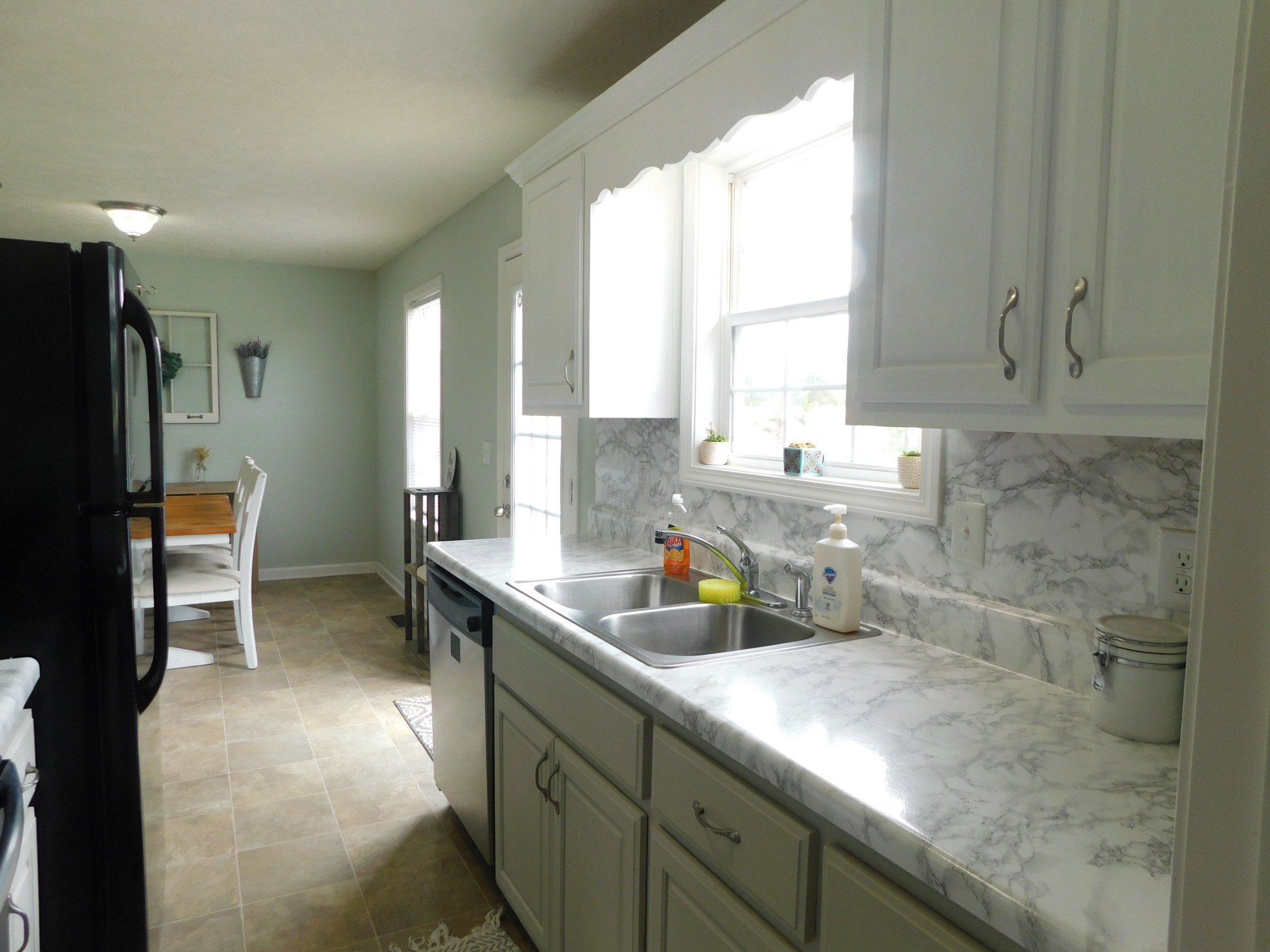 599 Jackson Road Portland, TN 37148 - Photo 15 of 39 a kitchen with a sink a counter top space and cabinets