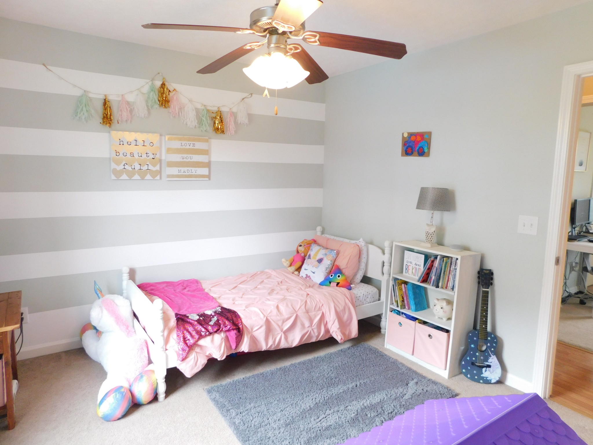 599 Jackson Road Portland, TN 37148 - Photo 19 of 39 a bedroom with a bed and a chandelier