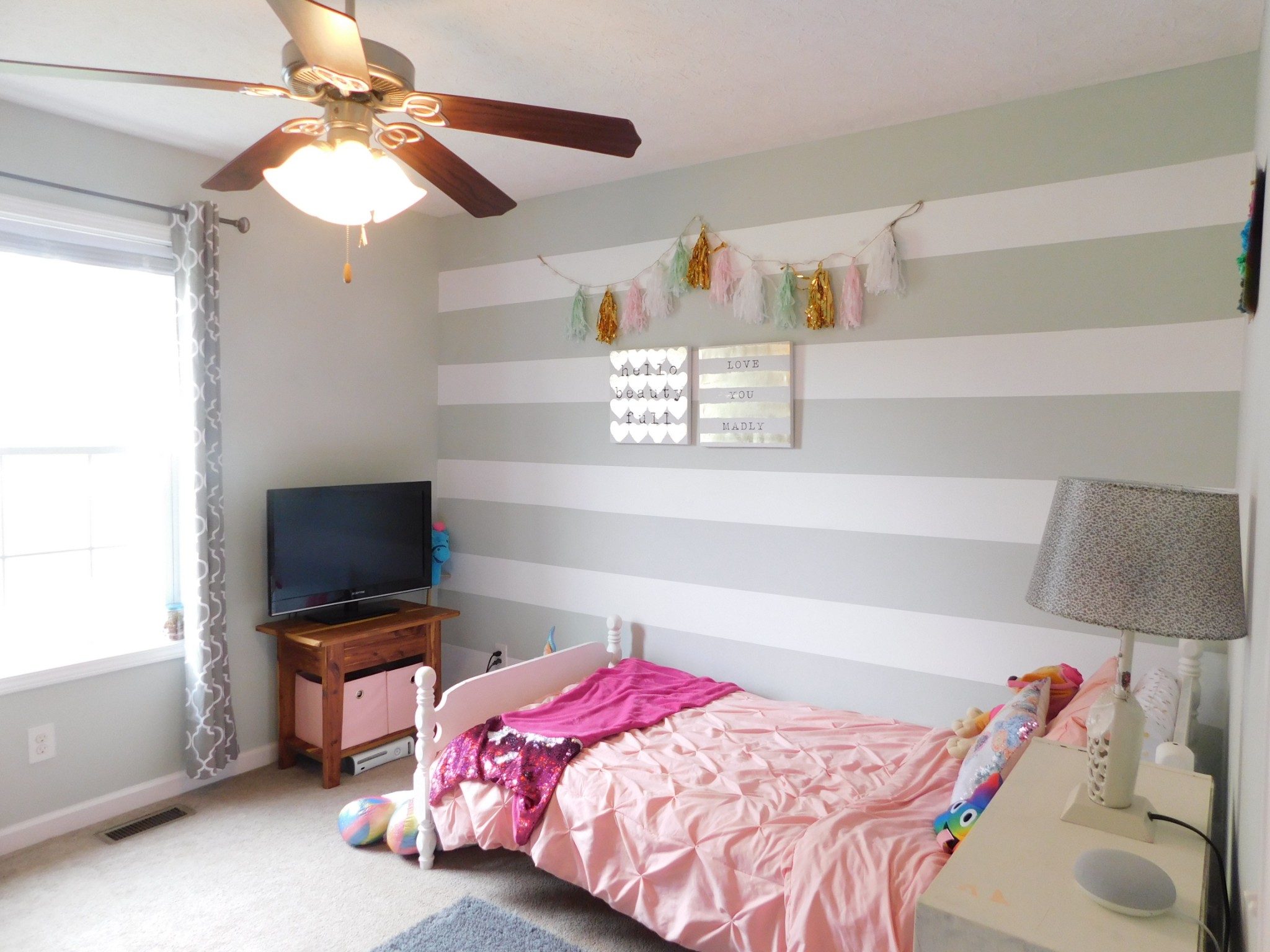 599 Jackson Road Portland, TN 37148 - Photo 20 of 39 a bedroom with a bed and a flat tv screen on the dresser