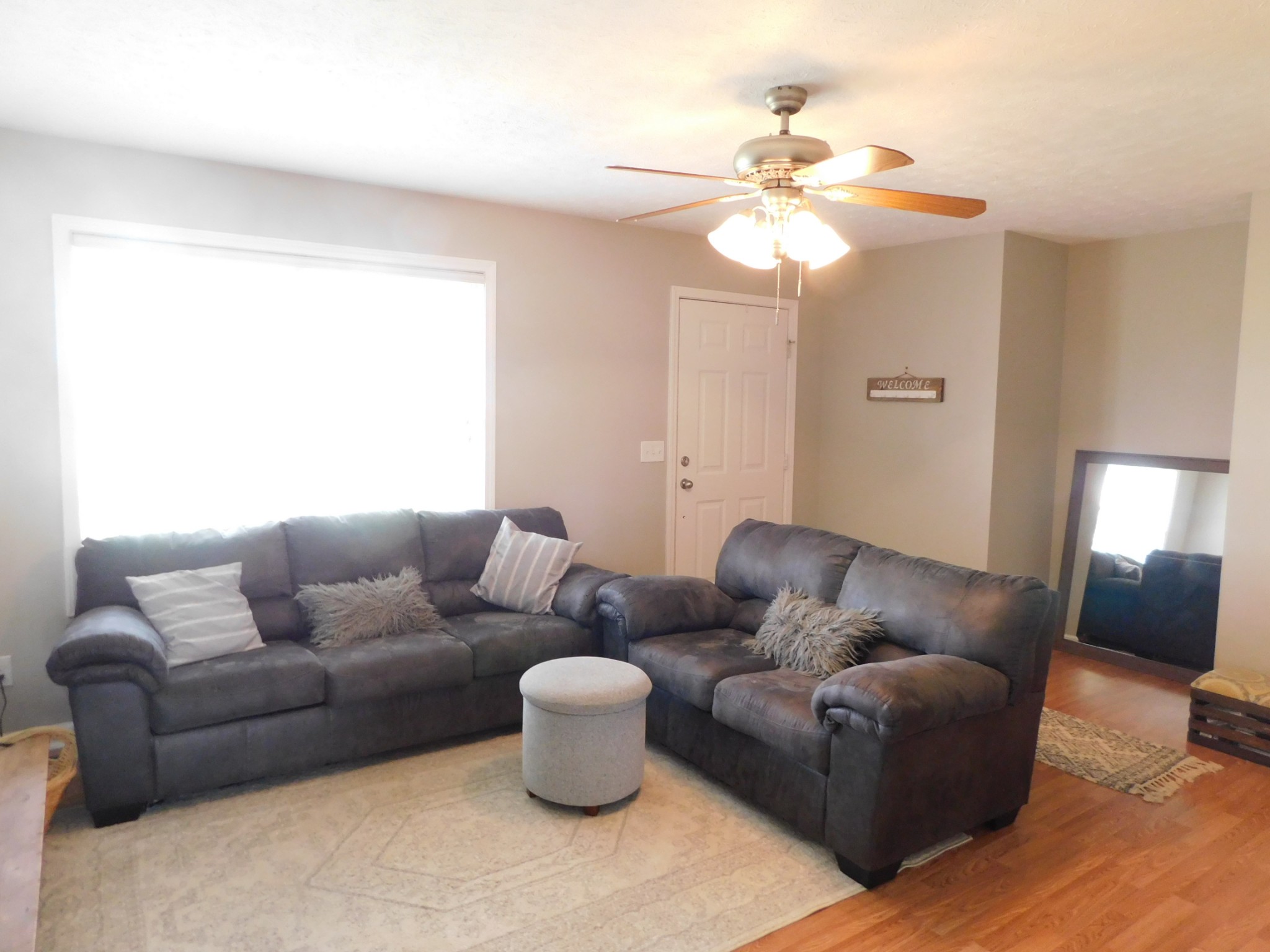 599 Jackson Road Portland, TN 37148 - Photo 5 of 39 a living room with furniture and a chandelier