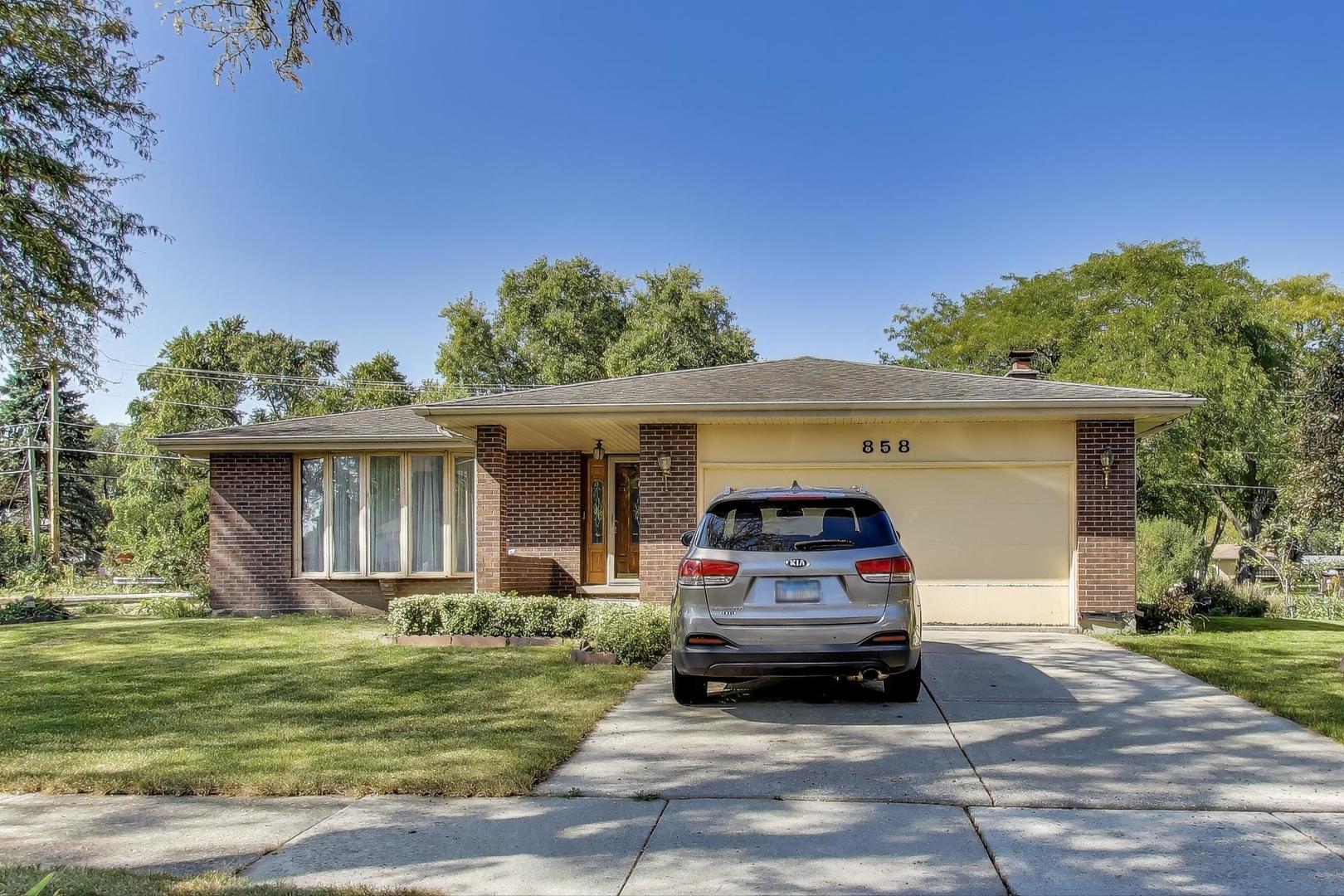 858 Academy Avenue Matteson, IL 60443 - Photo 1 of 20 a car parked in front of a house