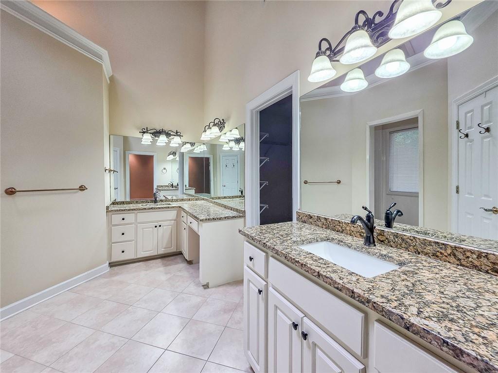 3712 Frederica Road Northwest Berkeley Lake, GA 30096 - Photo 31 of 49 a bathroom with a granite countertop double vanity sink and mirror