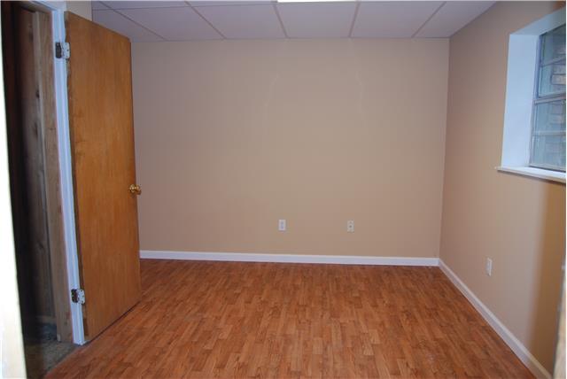 2899 Dodd Hollow Road Centerville, TN 37033 - Photo 10 of 20 flex room in basement with laminate flooring and window for lots of natural light