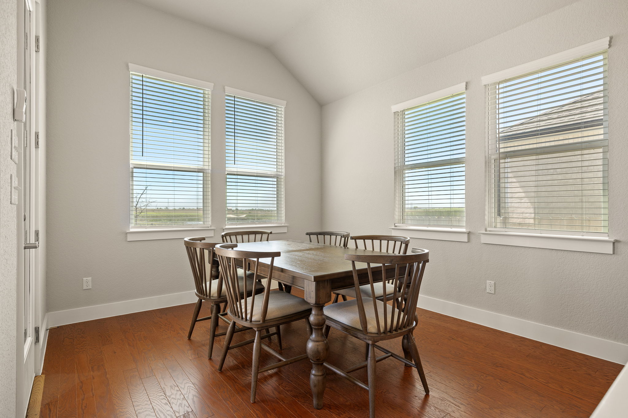 20409 Dustin Lane Pflugerville, TX 78660 - Photo 13 of 35 a view of a dining room with furniture and windows