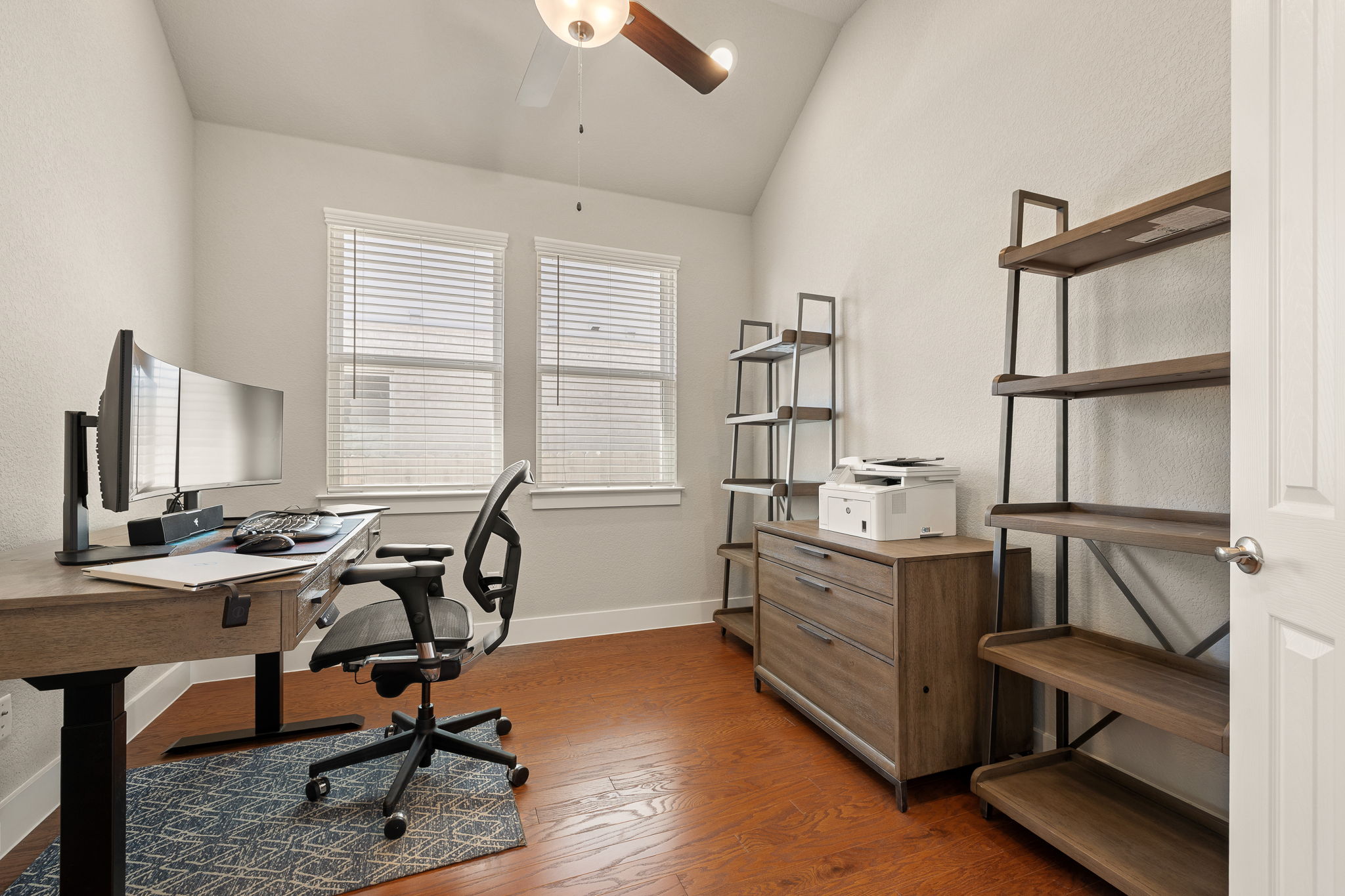 20409 Dustin Lane Pflugerville, TX 78660 - Photo 15 of 35 a view of a workspace with furniture and a window