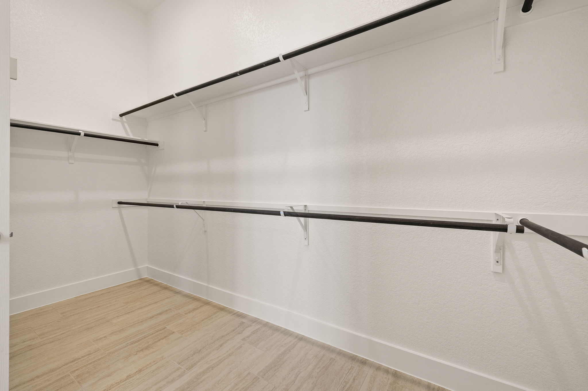 20409 Dustin Lane Pflugerville, TX 78660 - Photo 19 of 35 a view of an empty walk in closet