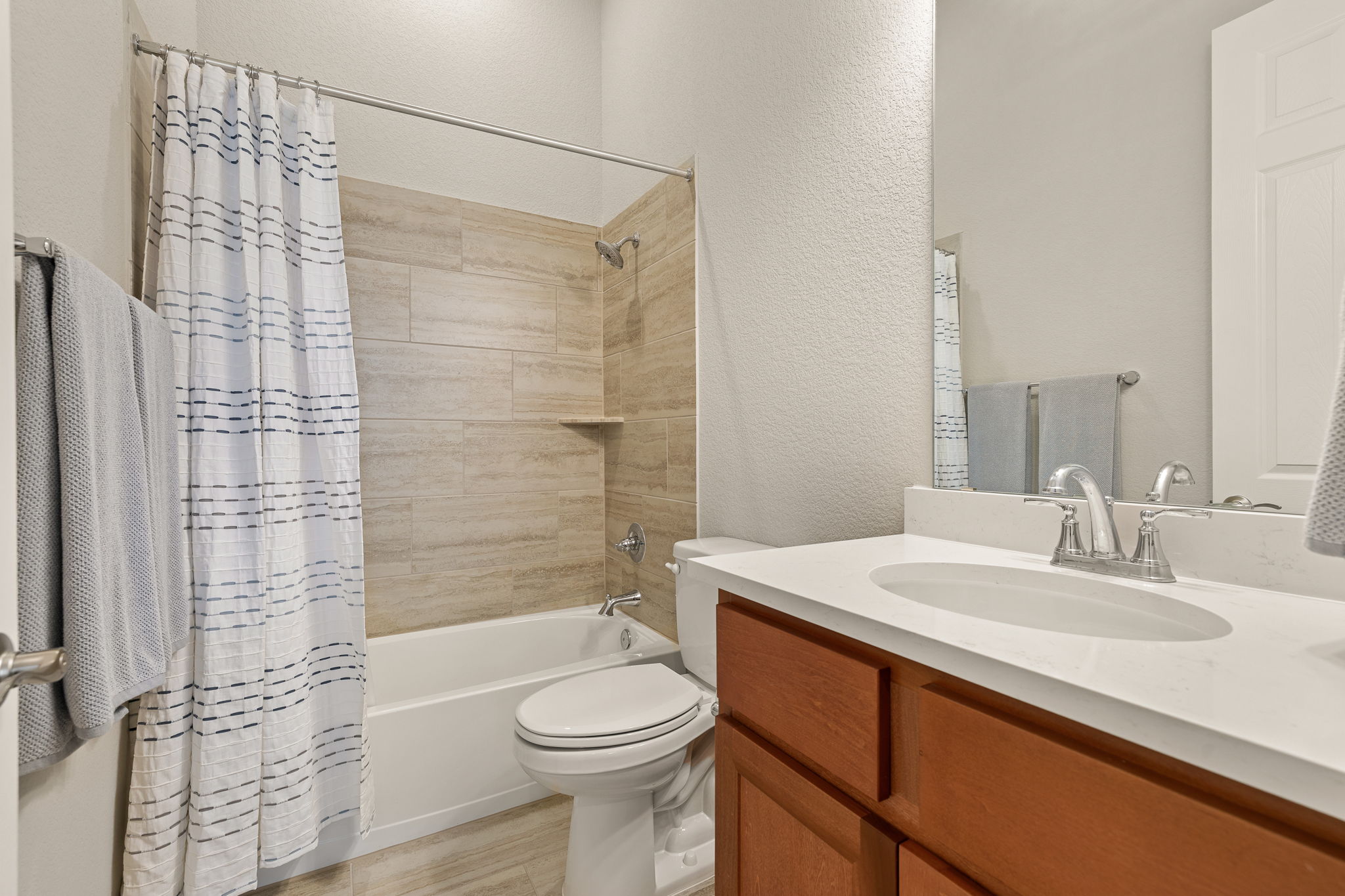 20409 Dustin Lane Pflugerville, TX 78660 - Photo 21 of 35 a bathroom with a sink a toilet and shower