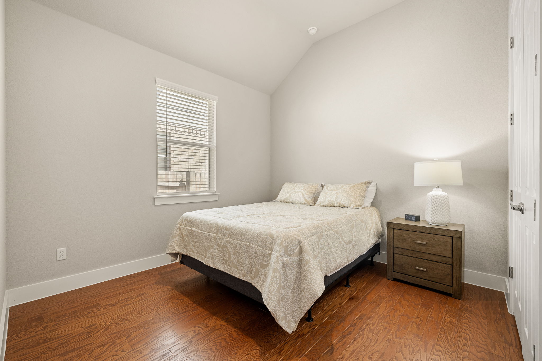 20409 Dustin Lane Pflugerville, TX 78660 - Photo 23 of 35 a bedroom with a bed and a window