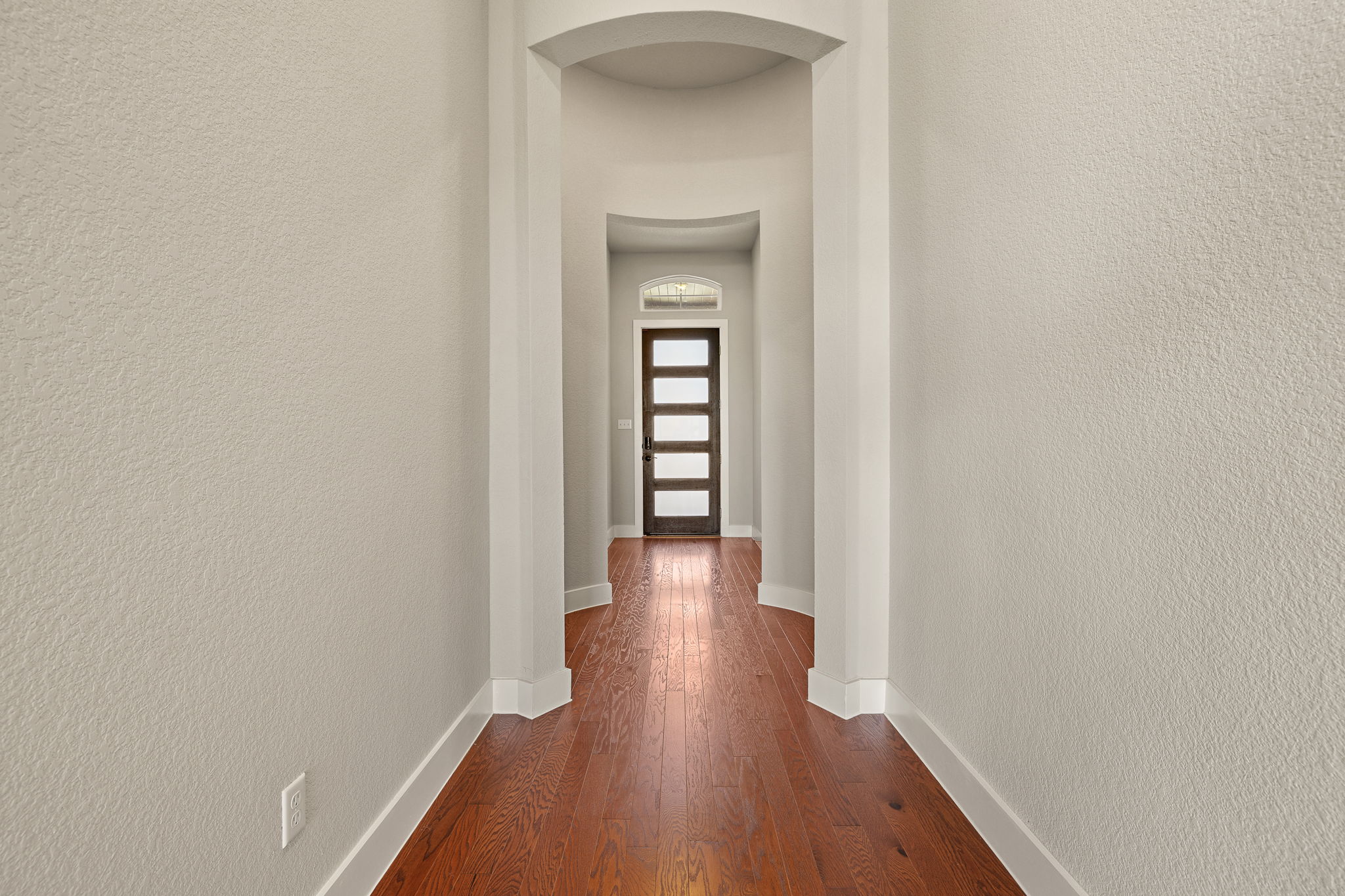 20409 Dustin Lane Pflugerville, TX 78660 - Photo 26 of 35 a view of a hallway with wooden floor
