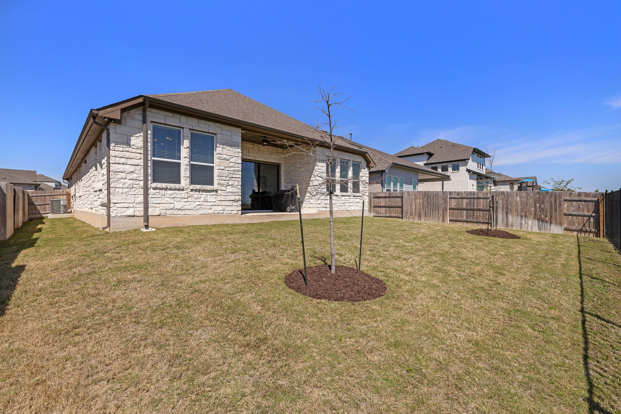 20409 Dustin Lane Pflugerville, TX 78660 - Photo 33 of 35 a front view of a house with a yard