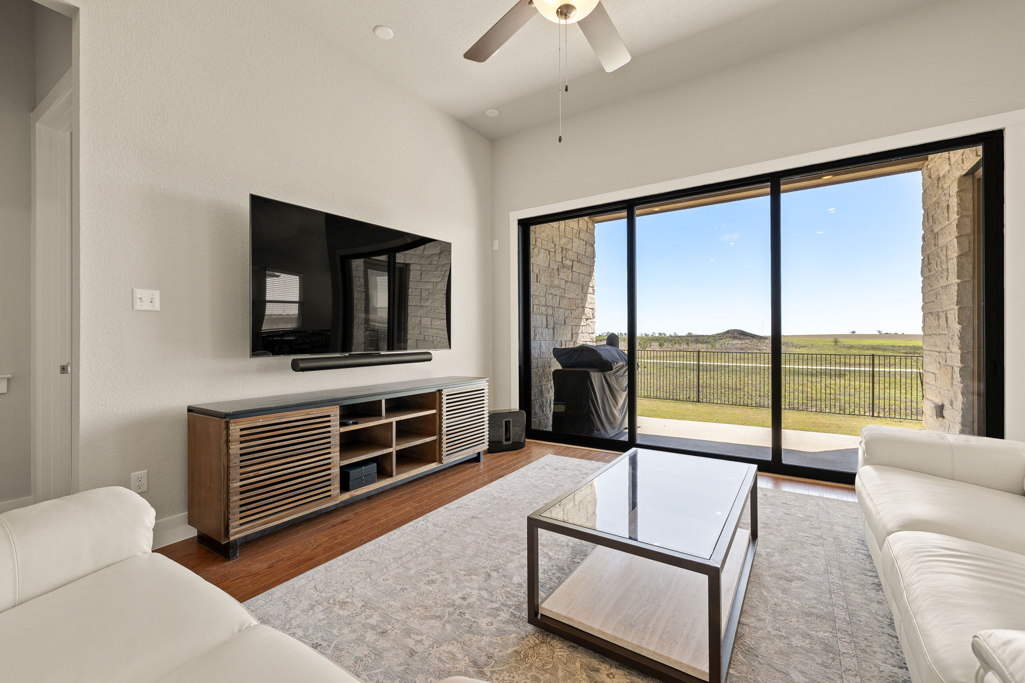 20409 Dustin Lane Pflugerville, TX 78660 - Photo 4 of 35 a living room with furniture and a flat screen tv
