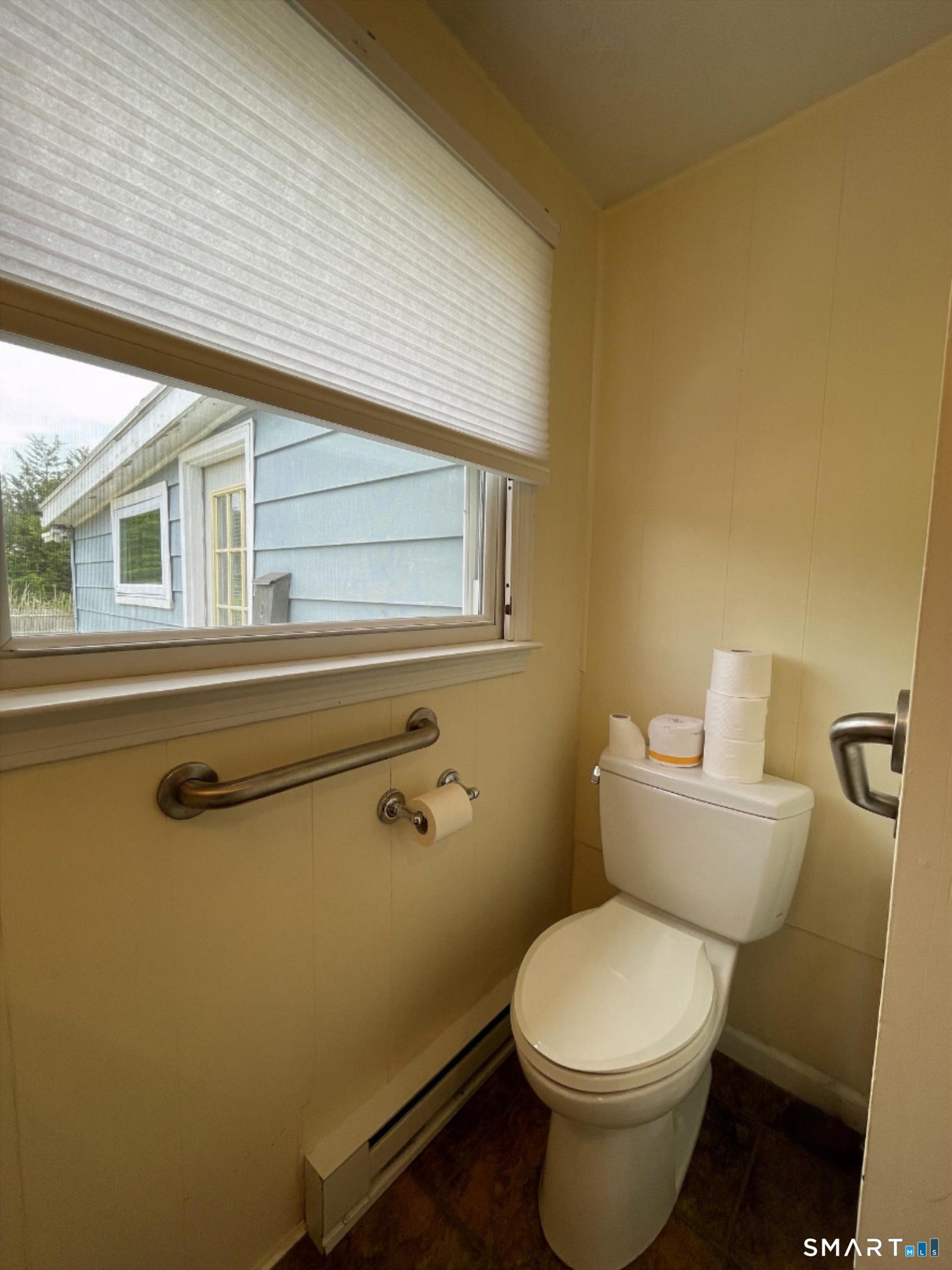 18 Old South Cove Road Old Saybrook, CT 06475 - Photo 40 of 40 a white toilet sitting next to a bathroom sink