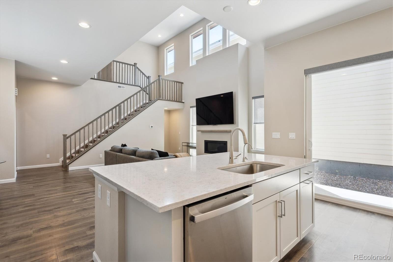10557 Eby Circle Lone Tree, CO 80124 - Photo 16 of 50 a kitchen with a stove a sink and a refrigerator