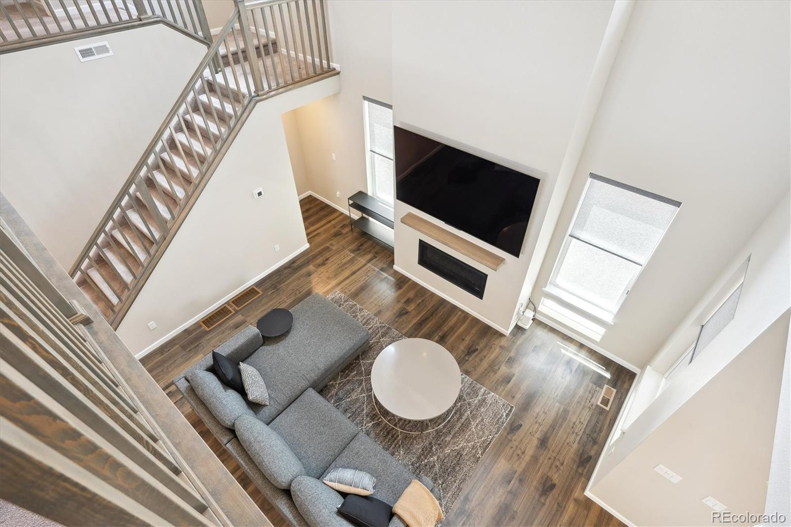 10557 Eby Circle Lone Tree, CO 80124 - Photo 24 of 50 a living room with furniture and a flat screen tv
