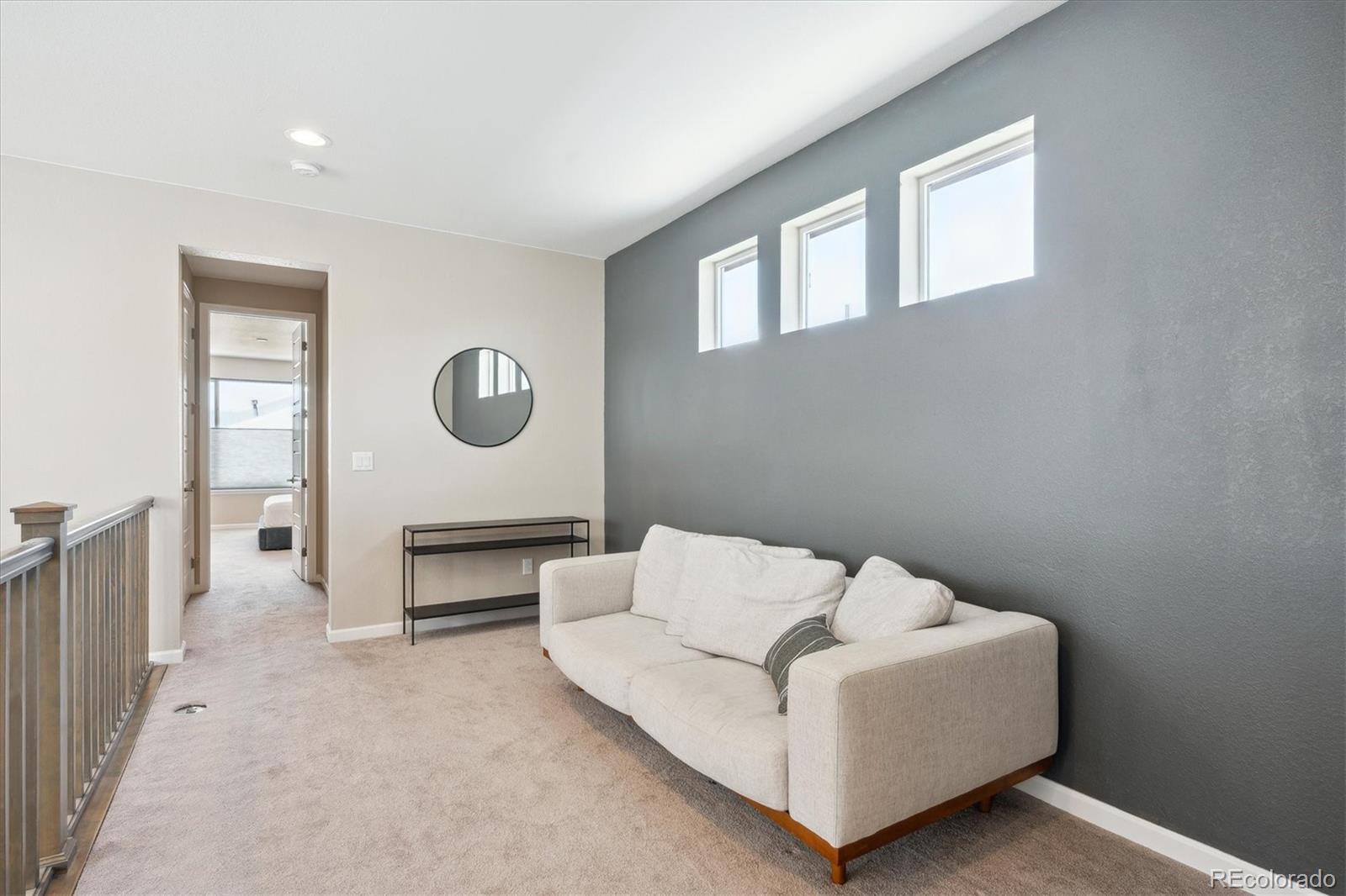10557 Eby Circle Lone Tree, CO 80124 - Photo 26 of 50 a living room with furniture and a window