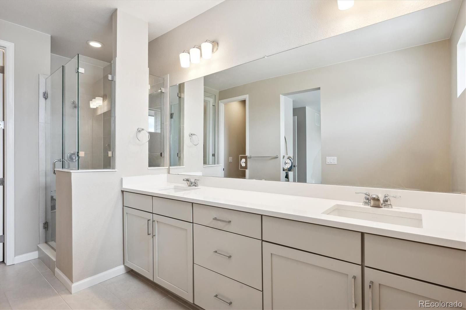 10557 Eby Circle Lone Tree, CO 80124 - Photo 31 of 50 a bathroom with a sink and a mirror
