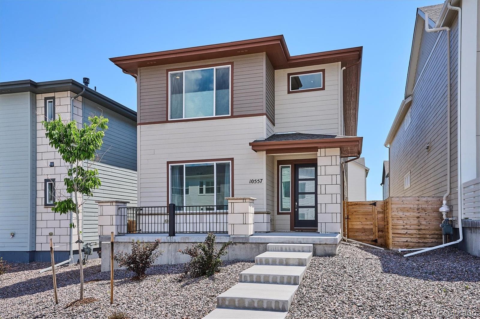 10557 Eby Circle Lone Tree, CO 80124 - Photo 50 of 50 a front view of a house with garden
