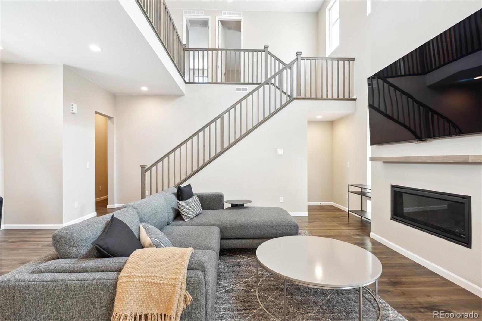 10557 Eby Circle Lone Tree, CO 80124 - Photo 5 of 50 a living room with furniture and a fireplace