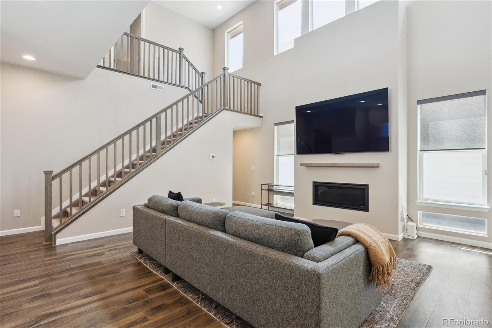 10557 Eby Circle Lone Tree, CO 80124 - Photo 7 of 50 a living room with fireplace furniture and a flat screen tv