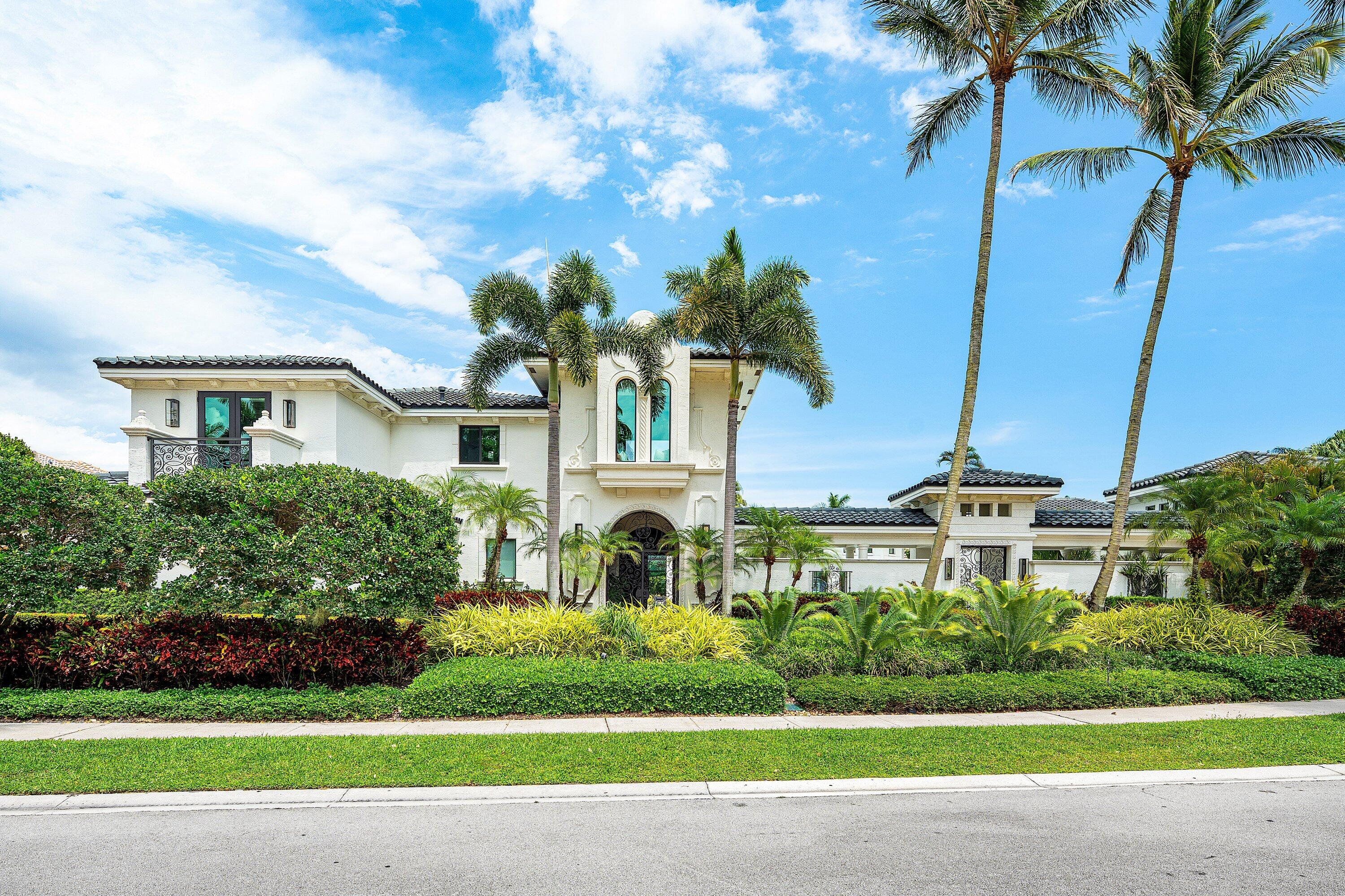 3633 Carlton Place Boca Raton, FL 33496 - Photo 1 of 99 a front view of a house with a garden and yard