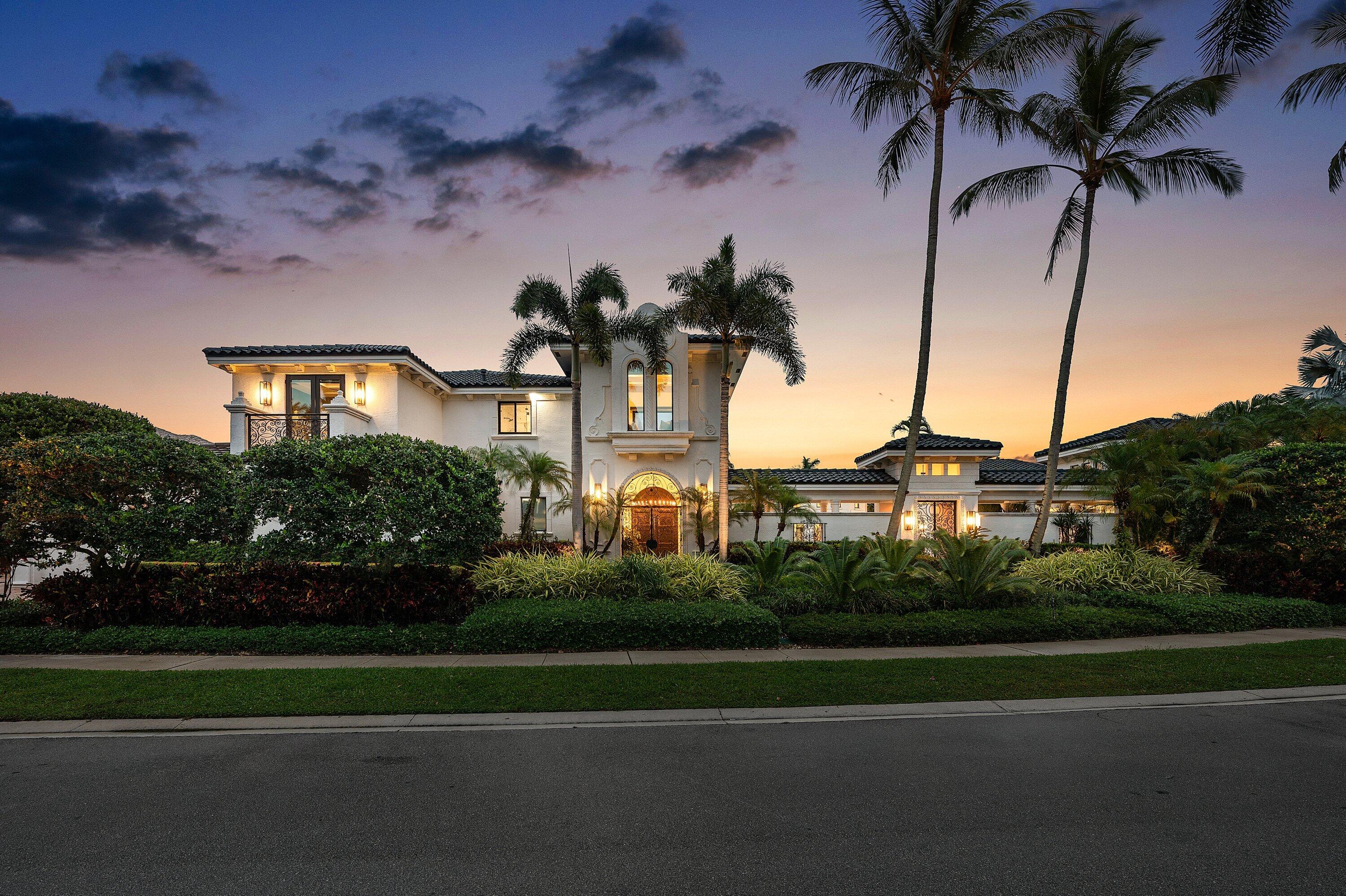 3633 Carlton Place Boca Raton, FL 33496 - Photo 2 of 99 a front view of a house with a garden and trees