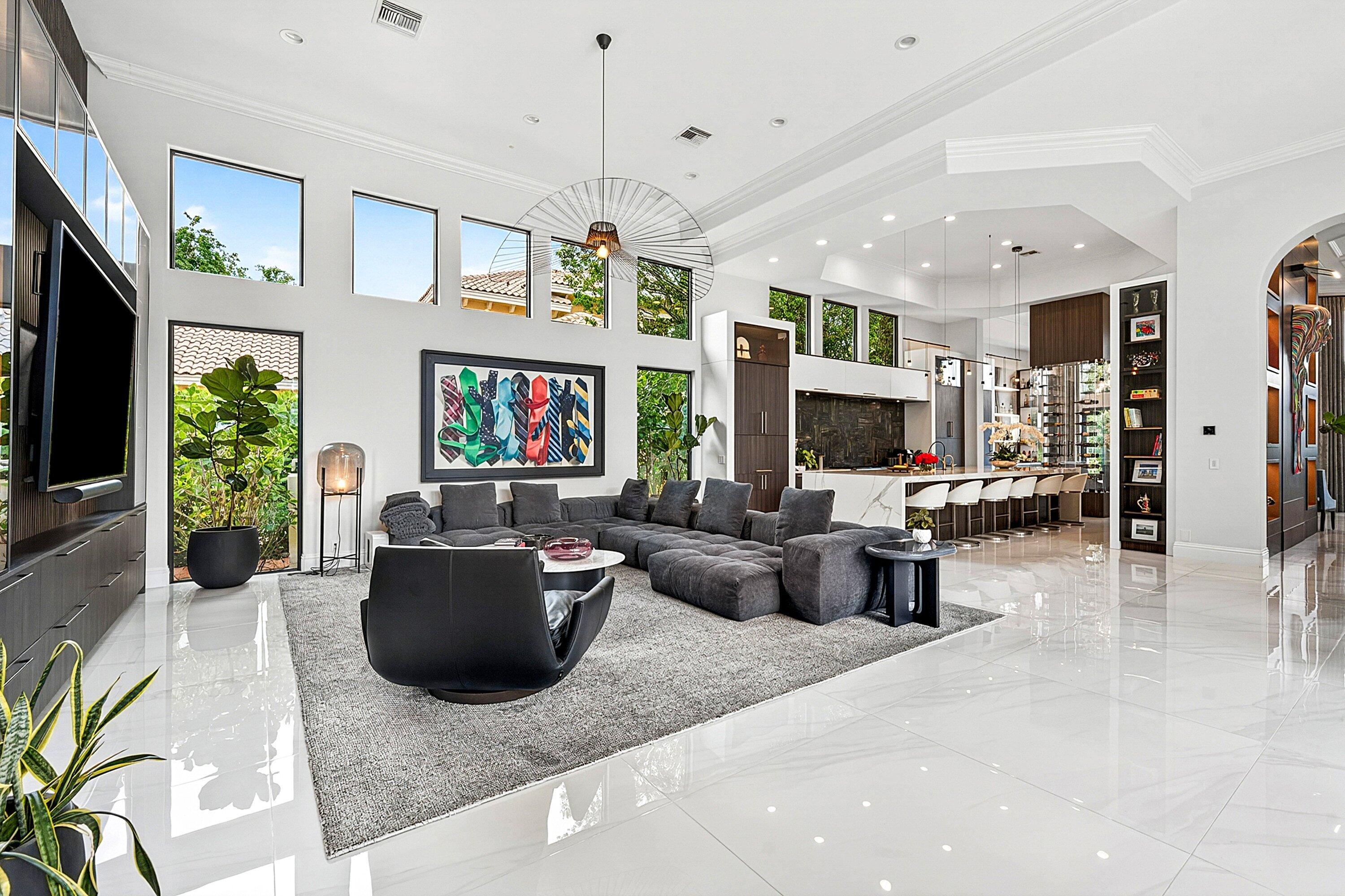 3633 Carlton Place Boca Raton, FL 33496 - Photo 21 of 99 a living room with furniture a flat screen tv and a fireplace