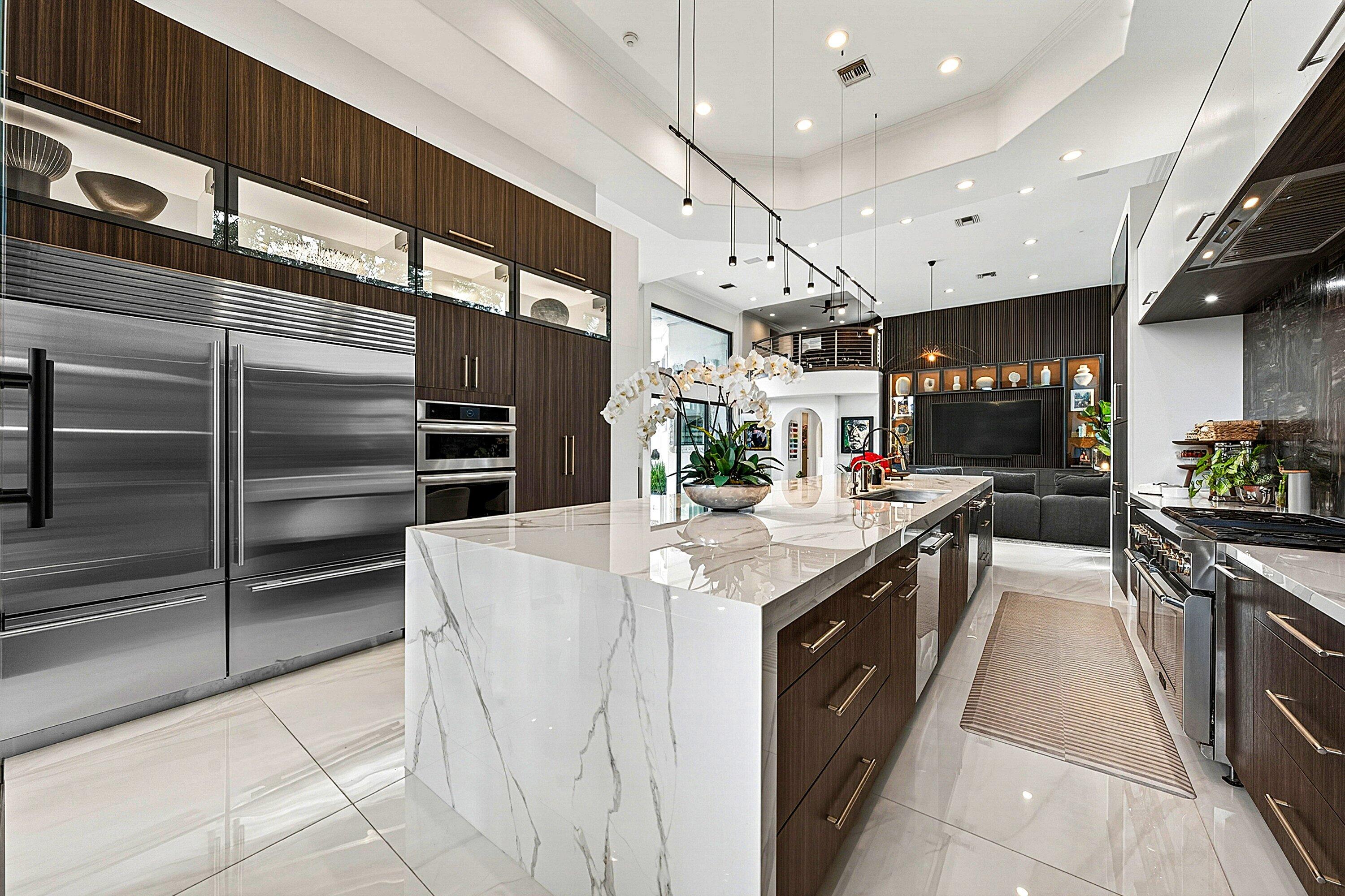 3633 Carlton Place Boca Raton, FL 33496 - Photo 24 of 99 a kitchen with stainless steel appliances kitchen island granite countertop a sink and cabinets