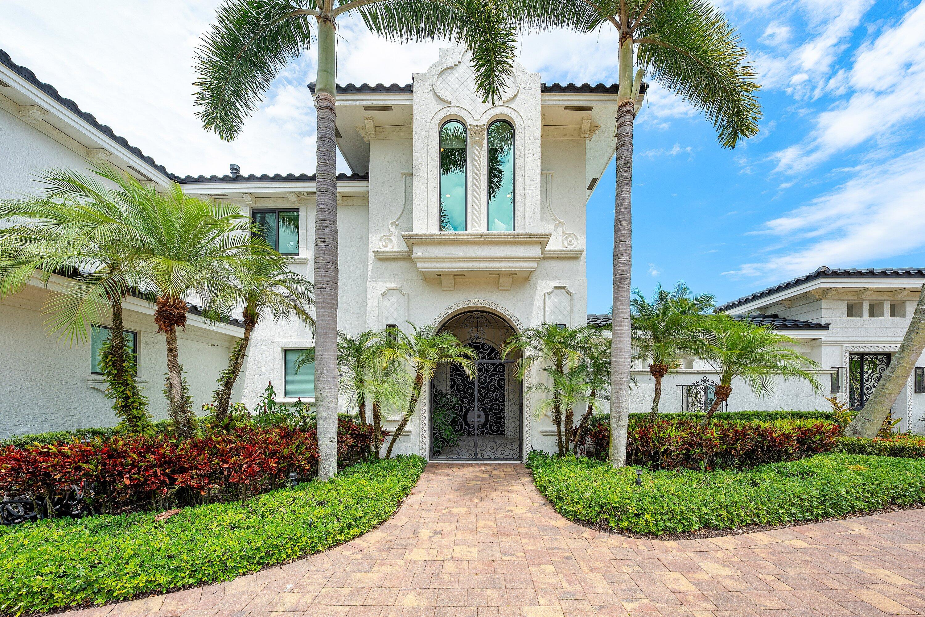 3633 Carlton Place Boca Raton, FL 33496 - Photo 3 of 99 a front view of a house with a garden
