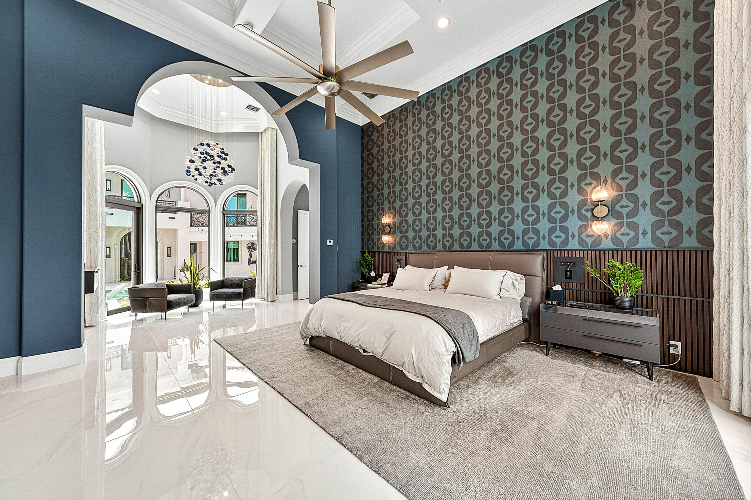 3633 Carlton Place Boca Raton, FL 33496 - Photo 37 of 99 a spacious bedroom with a large bed and a chandelier