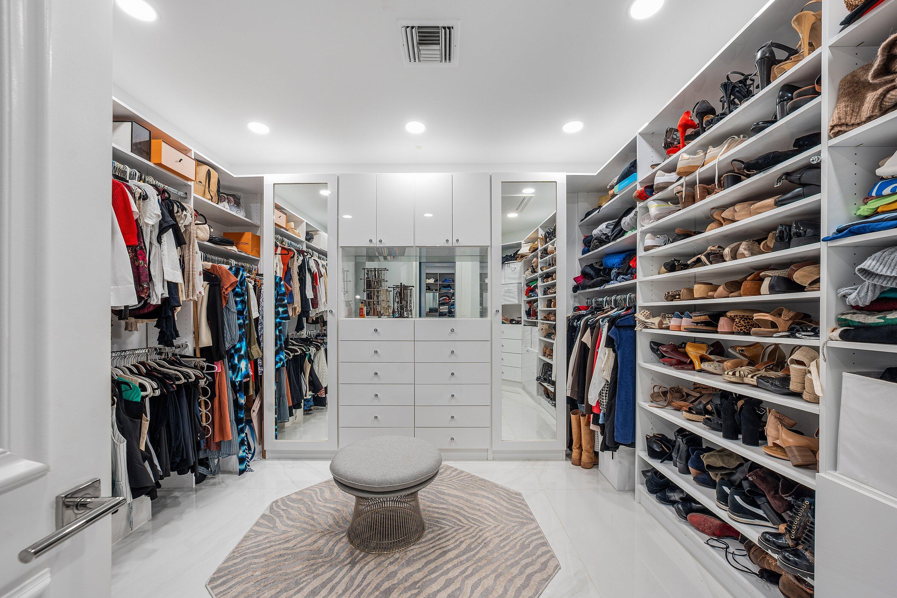 3633 Carlton Place Boca Raton, FL 33496 - Photo 45 of 99 a view of walk in closet with clothes and shoes