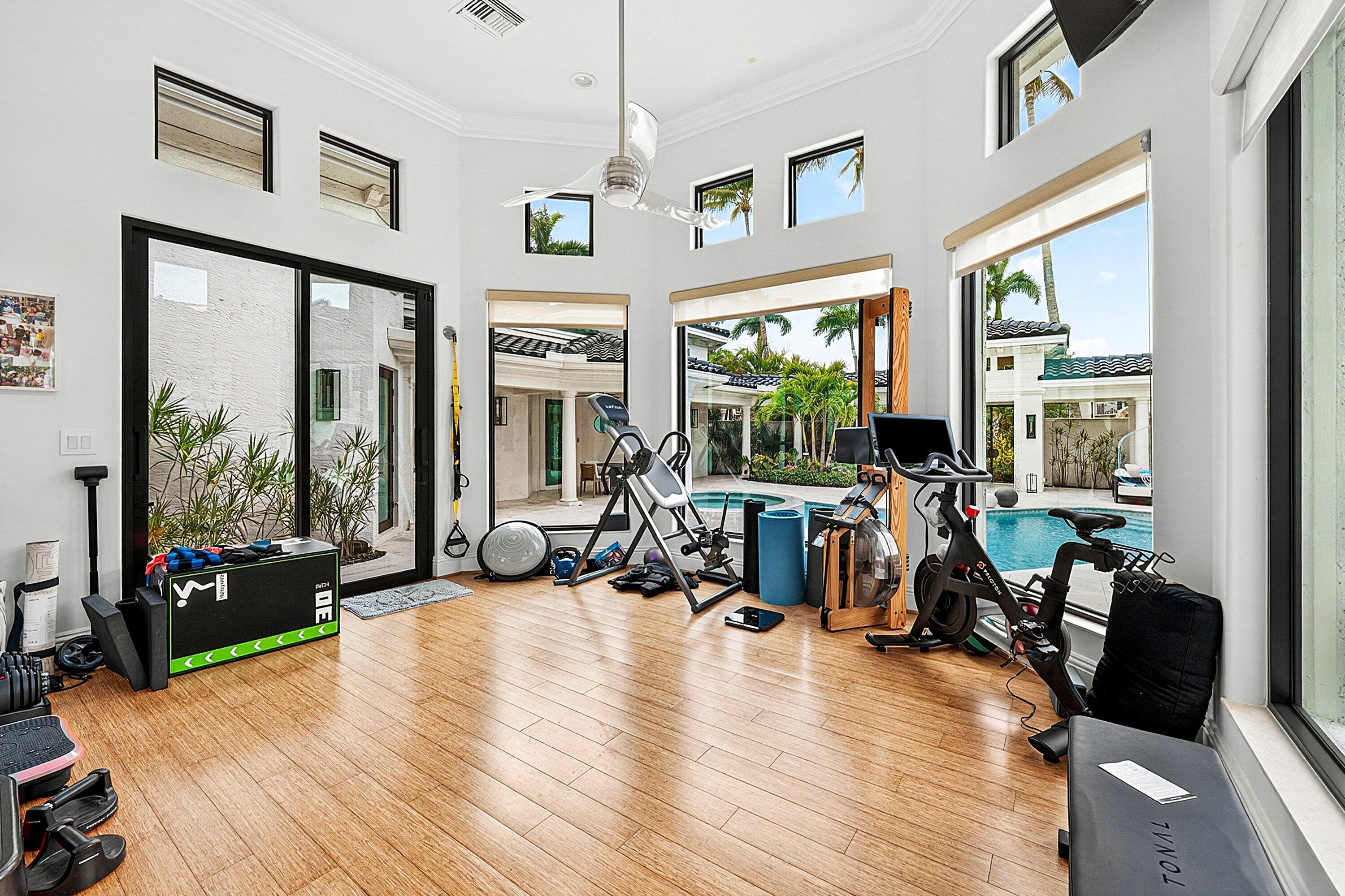 3633 Carlton Place Boca Raton, FL 33496 - Photo 46 of 99 a living room with furniture large window and a flat screen tv