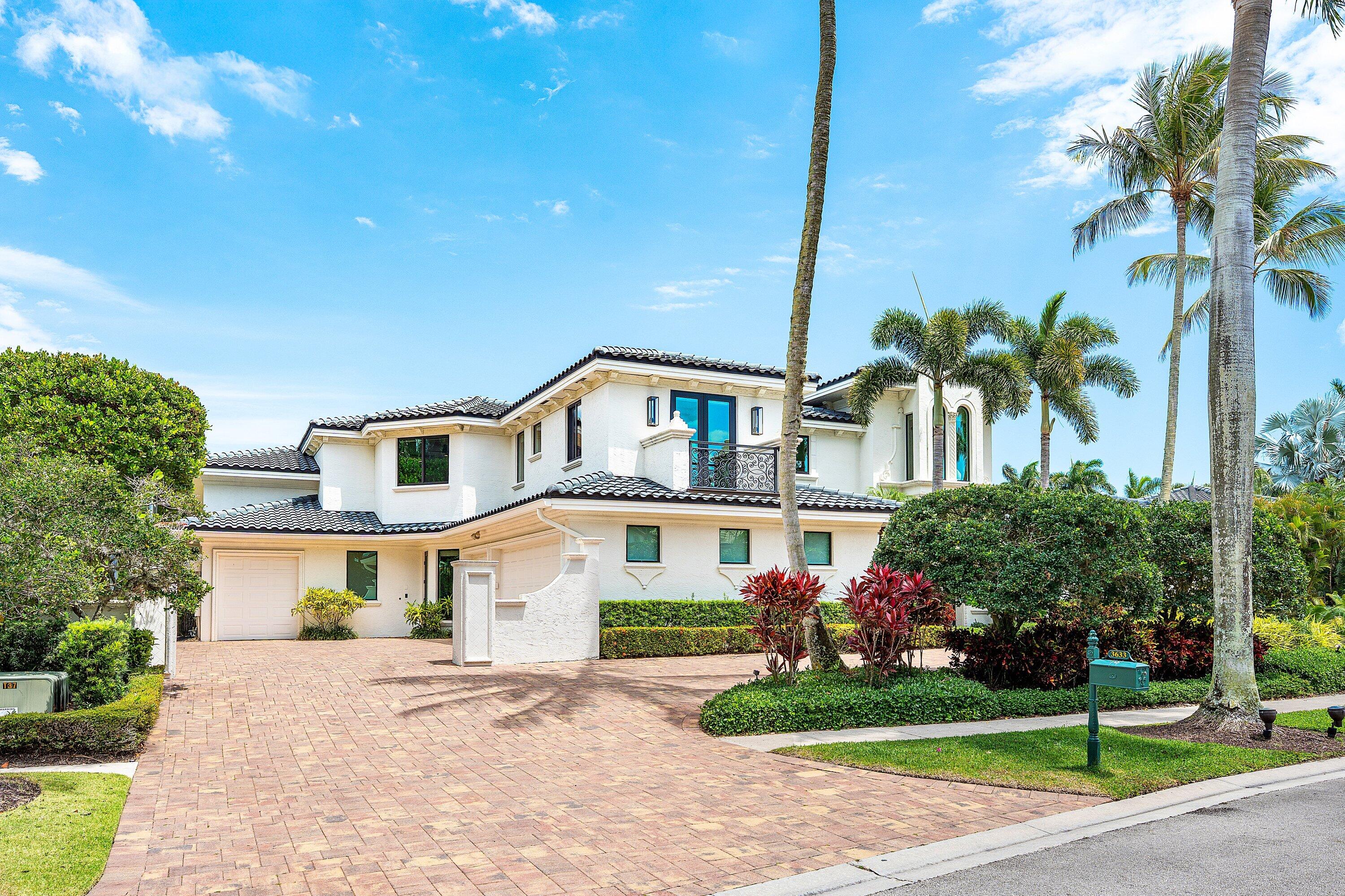3633 Carlton Place Boca Raton, FL 33496 - Photo 5 of 99 a front view of a house with a yard and trees