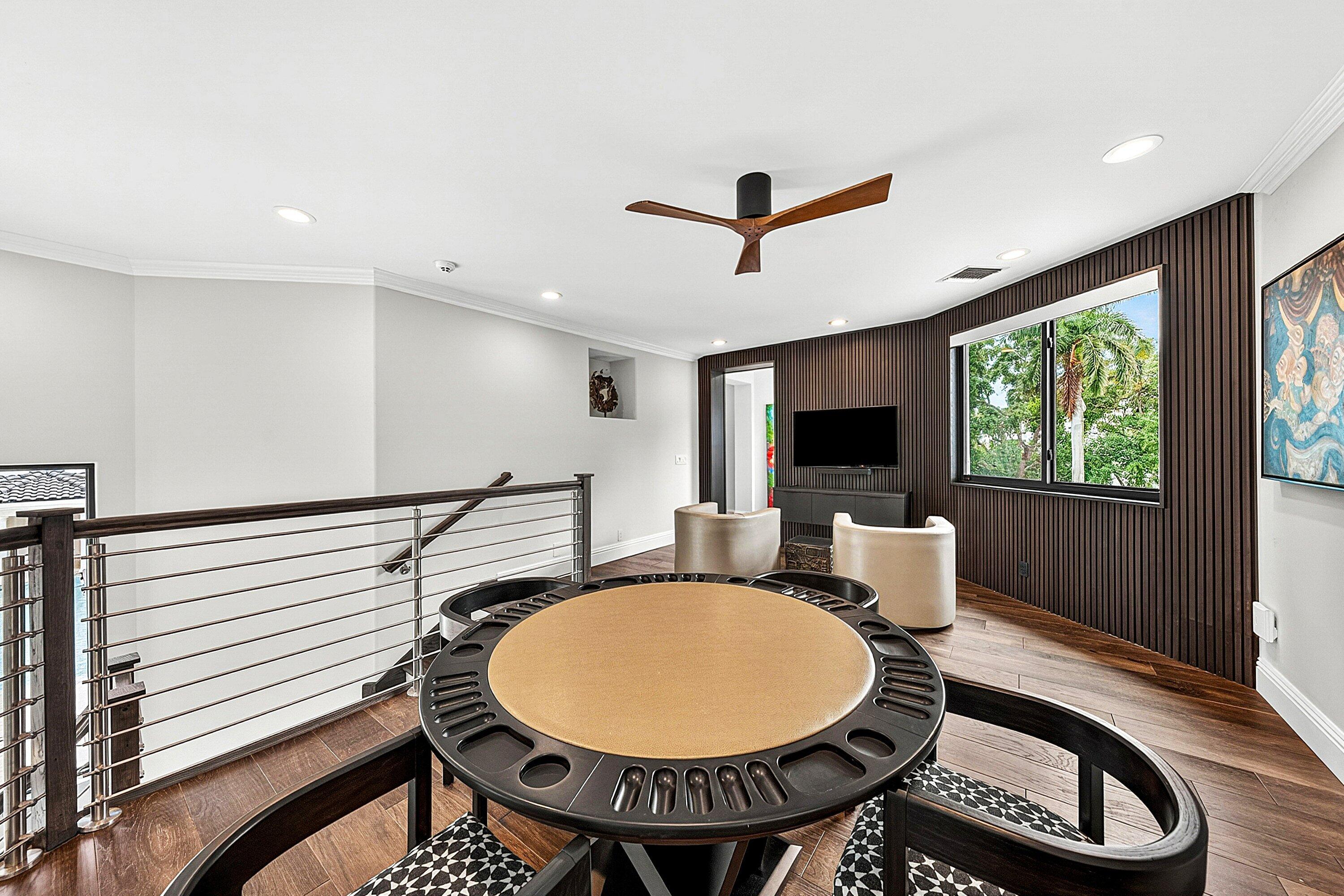 3633 Carlton Place Boca Raton, FL 33496 - Photo 55 of 99 a living room with furniture a flat screen tv and a large window