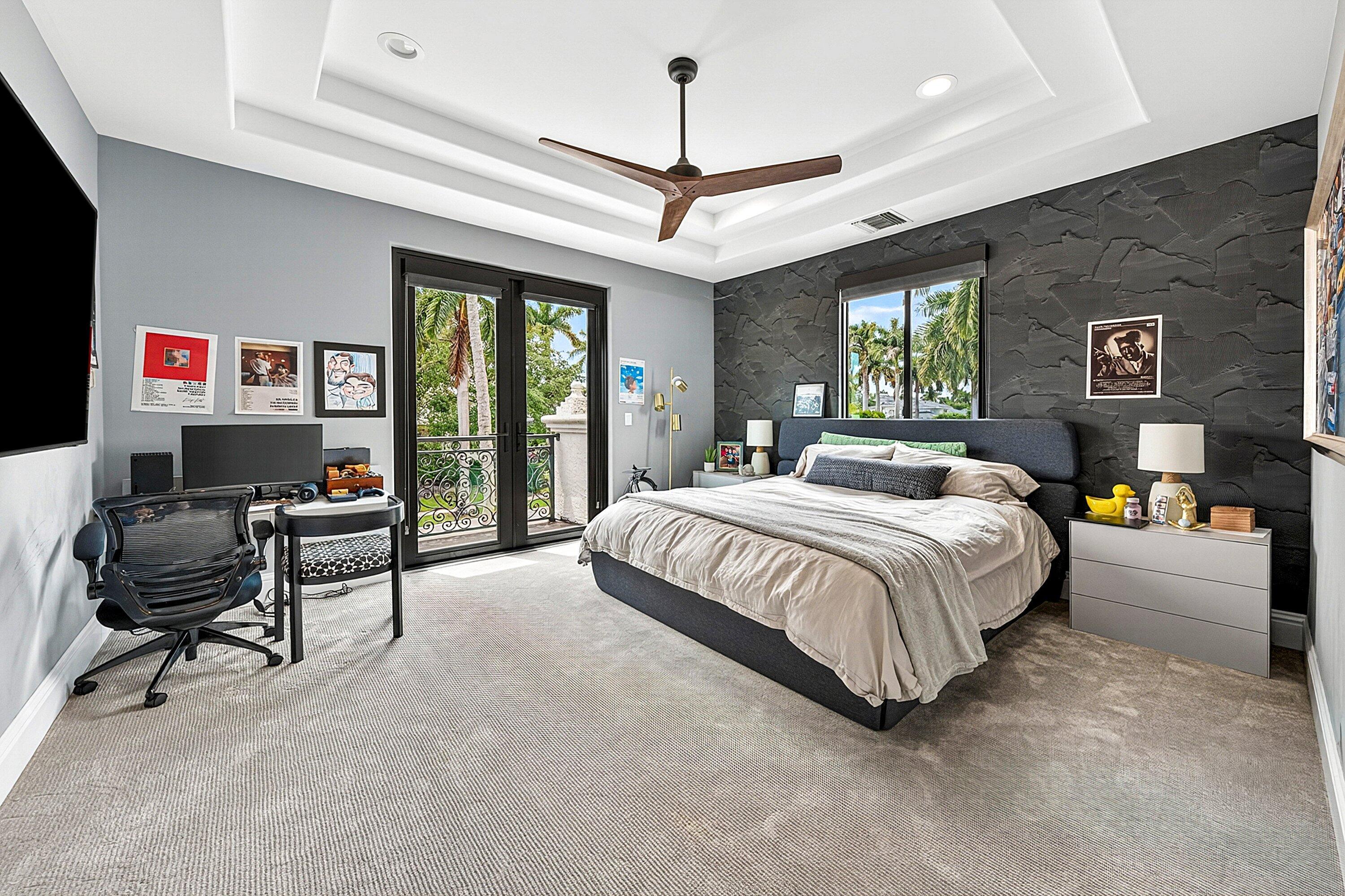3633 Carlton Place Boca Raton, FL 33496 - Photo 57 of 99 a spacious bedroom with a bed a couch and a chandelier