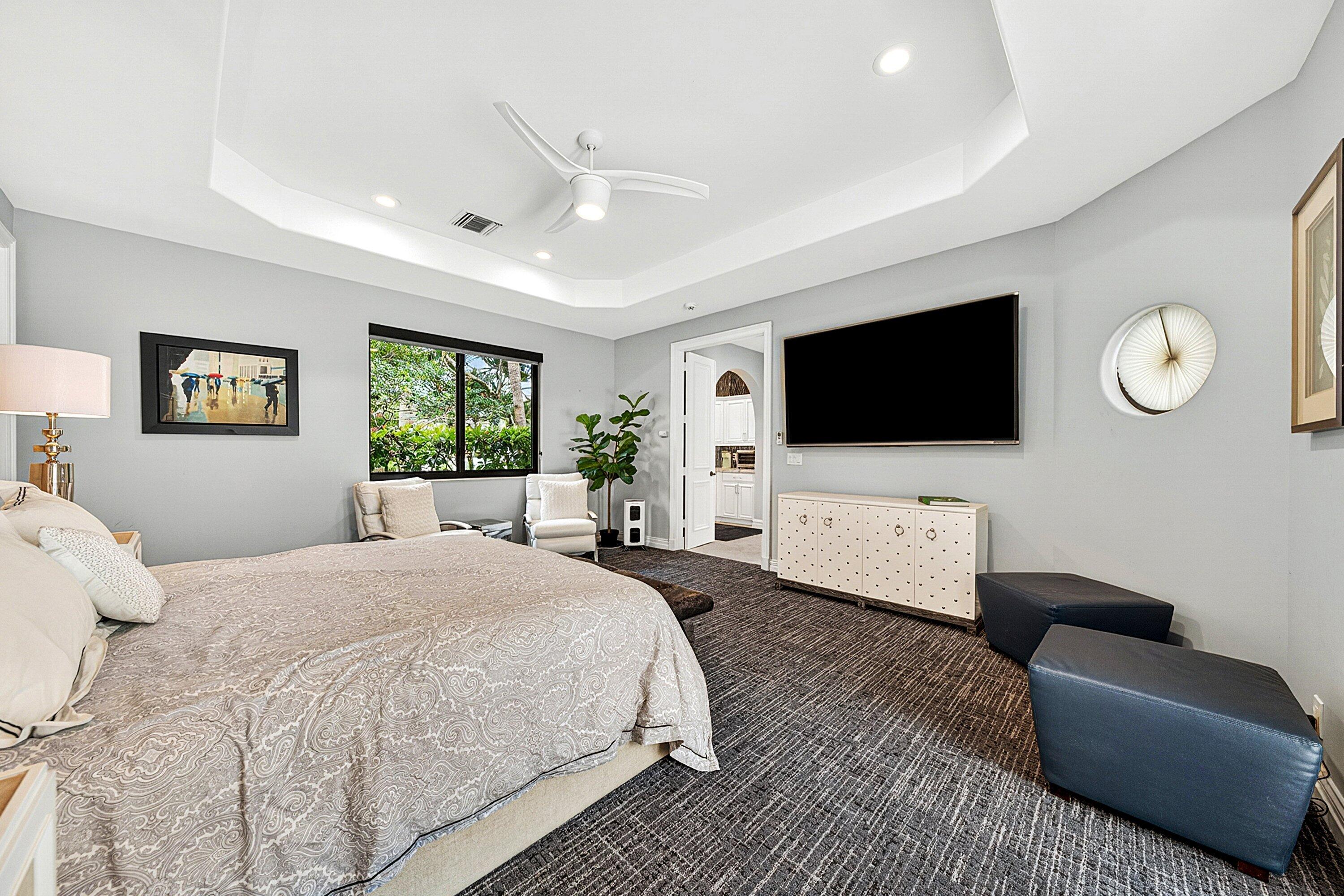 3633 Carlton Place Boca Raton, FL 33496 - Photo 68 of 99 a bedroom with a bed a window and a flat screen television