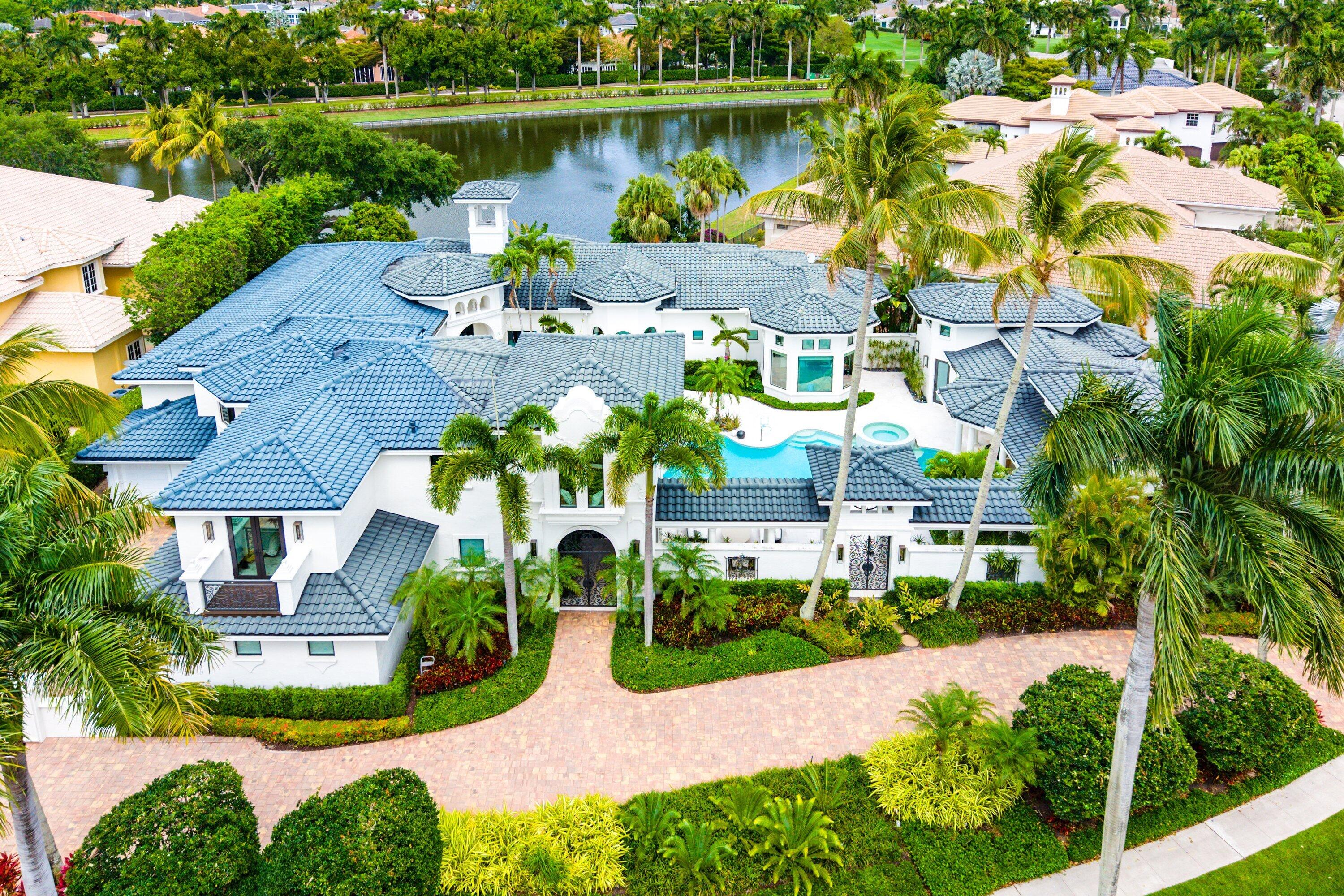 3633 Carlton Place Boca Raton, FL 33496 - Photo 81 of 99 an aerial view of a house with a garden and lake view