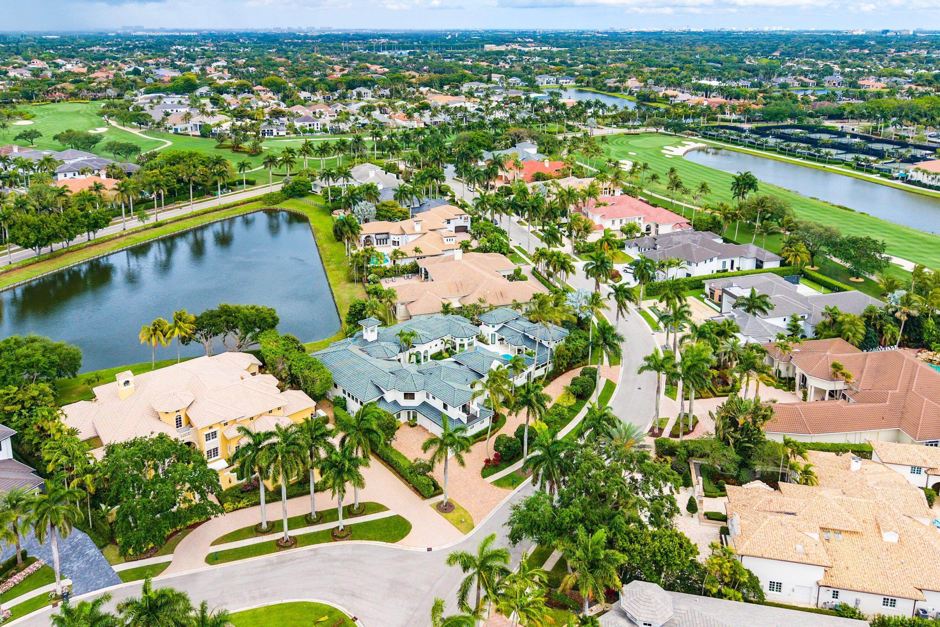 3633 Carlton Place Boca Raton, FL 33496 - Photo 89 of 99 an aerial view of a city with lots of residential buildings ocean and mountain view in back