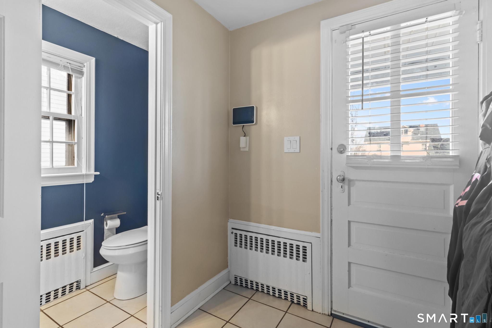 168 Hubbard Road Hartford, CT 06114 - Photo 12 of 27 a bathroom with a sink toilet and a window