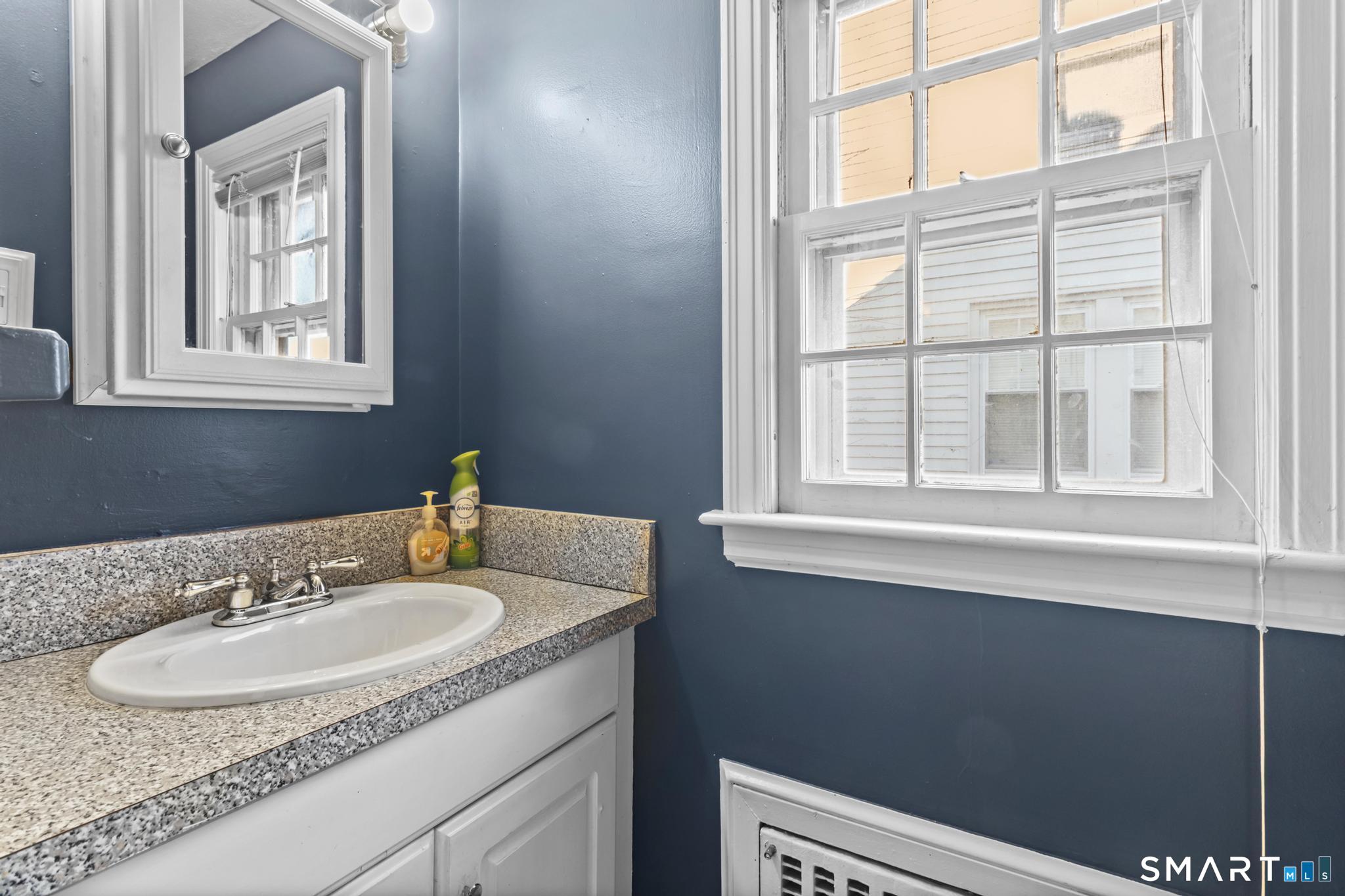 168 Hubbard Road Hartford, CT 06114 - Photo 13 of 27 a bathroom with a sink and a mirror