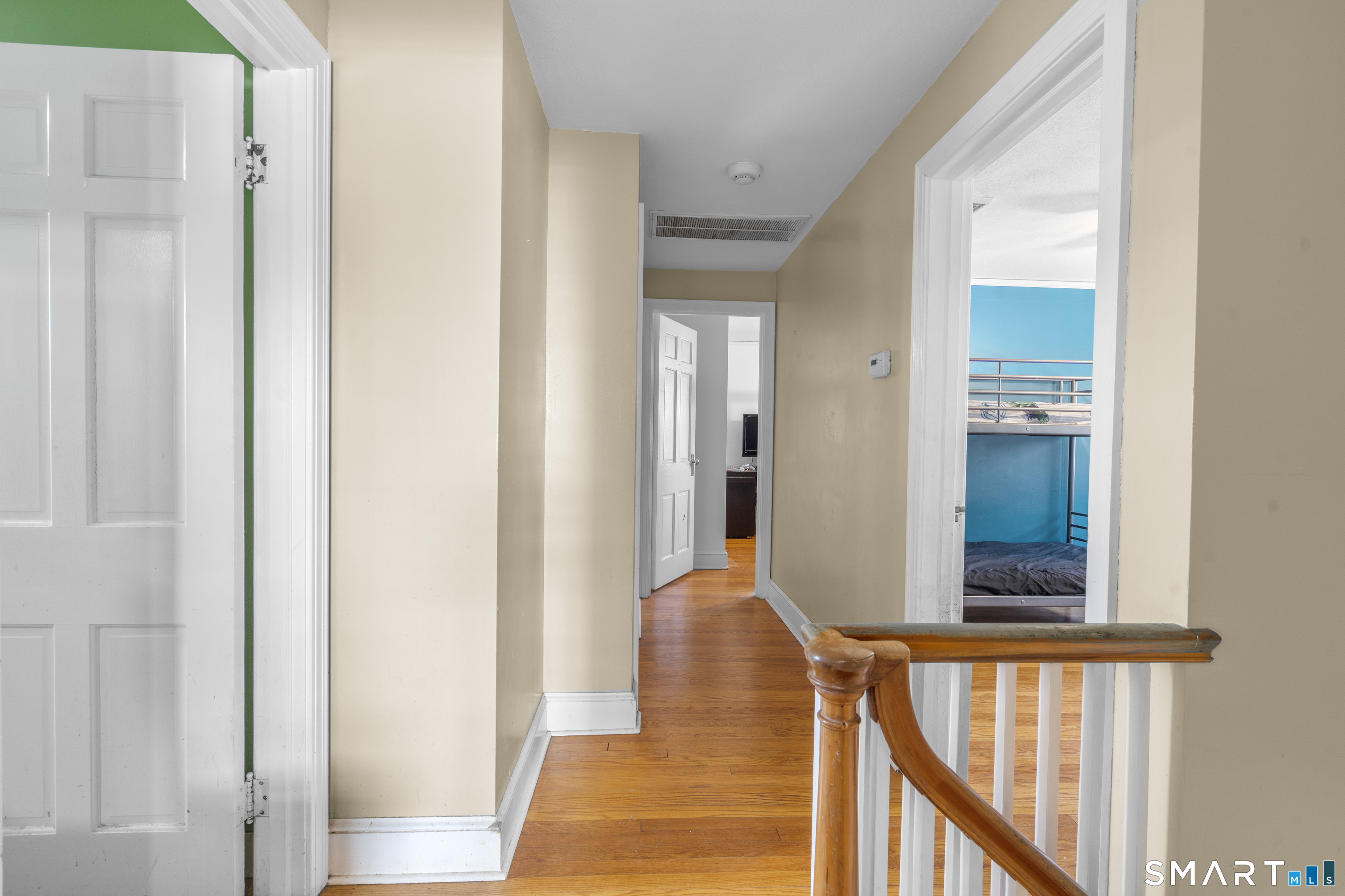 168 Hubbard Road Hartford, CT 06114 - Photo 14 of 27 a view of a hallway with wooden floor and staircase