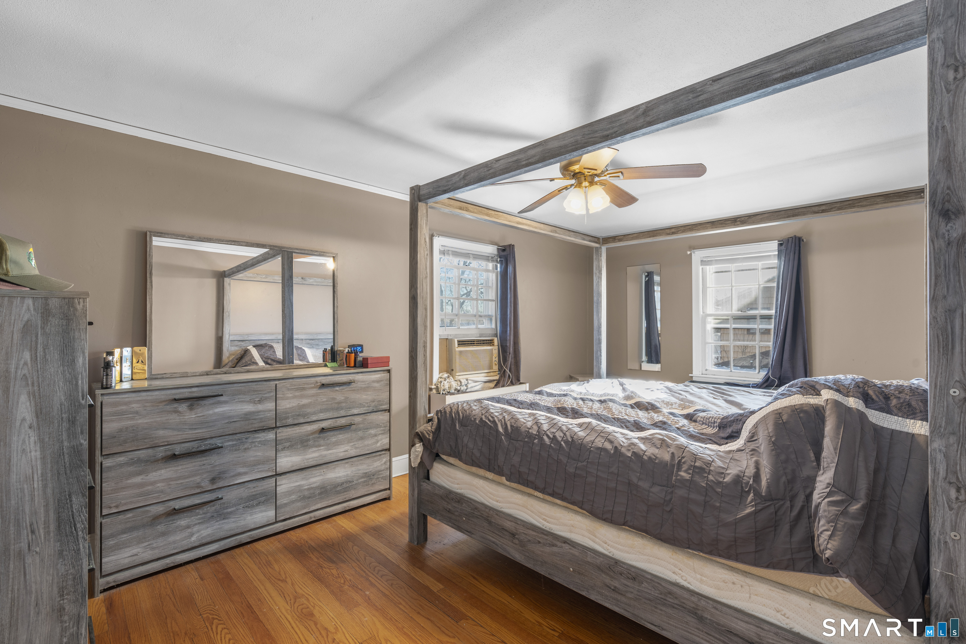 168 Hubbard Road Hartford, CT 06114 - Photo 15 of 27 a bedroom with a bed and large windows