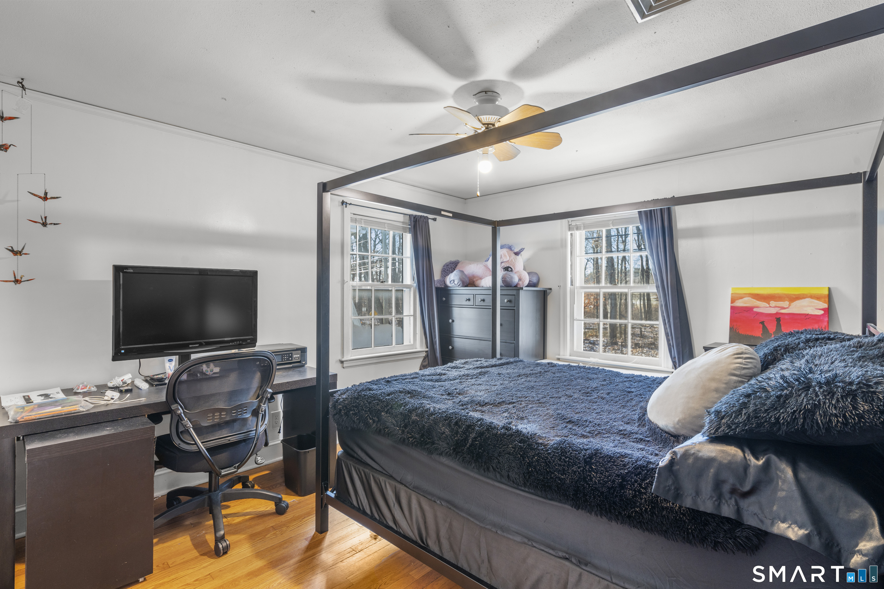 168 Hubbard Road Hartford, CT 06114 - Photo 19 of 27 a bedroom with a large bed and a flat screen tv