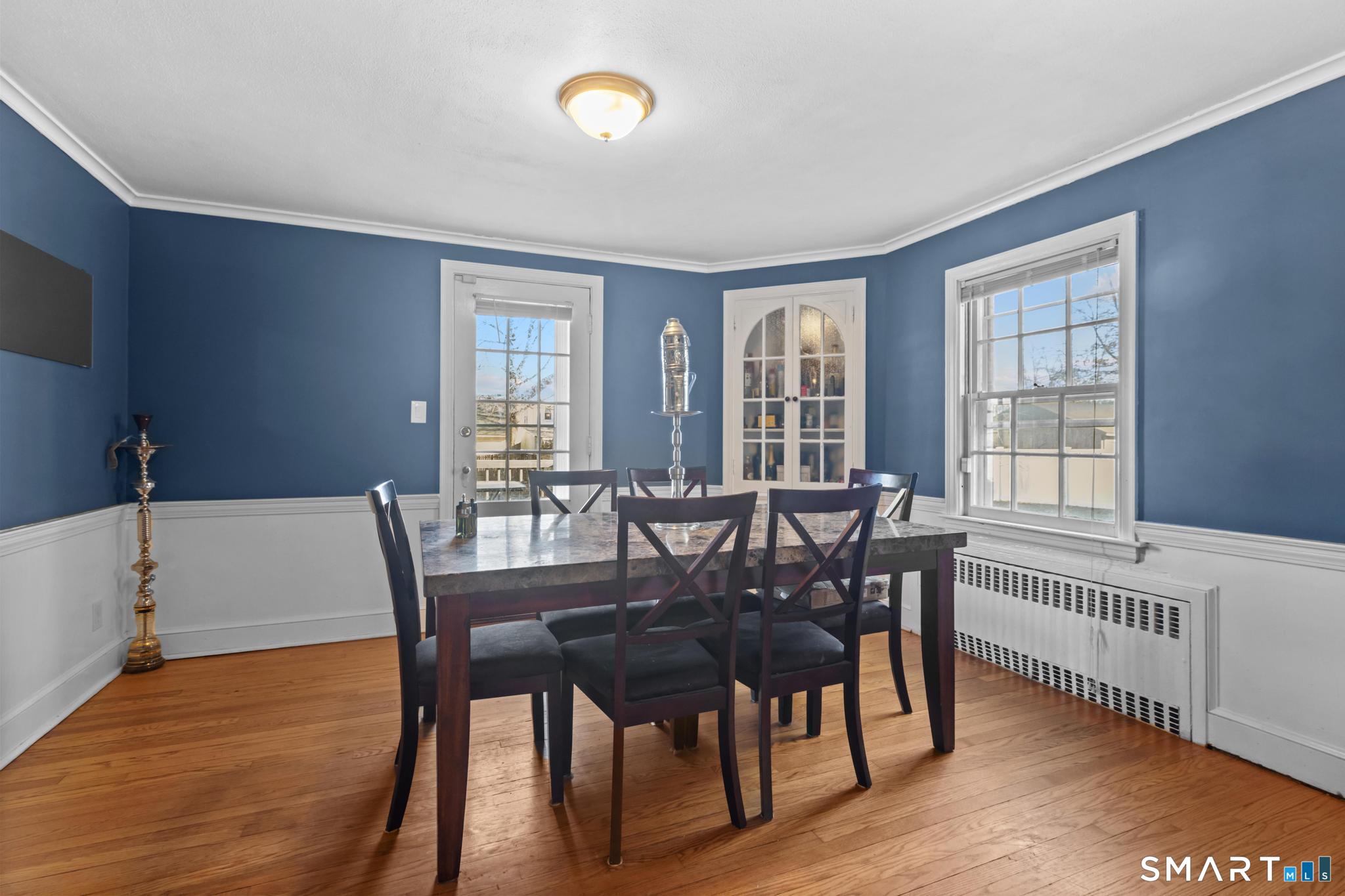168 Hubbard Road Hartford, CT 06114 - Photo 6 of 27 a view of a a dining room with furniture window and wooden floor