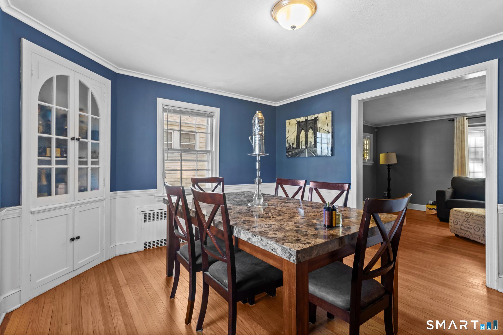 168 Hubbard Road Hartford, CT 06114 - Photo 7 of 27 a dining room with furniture and wooden floor