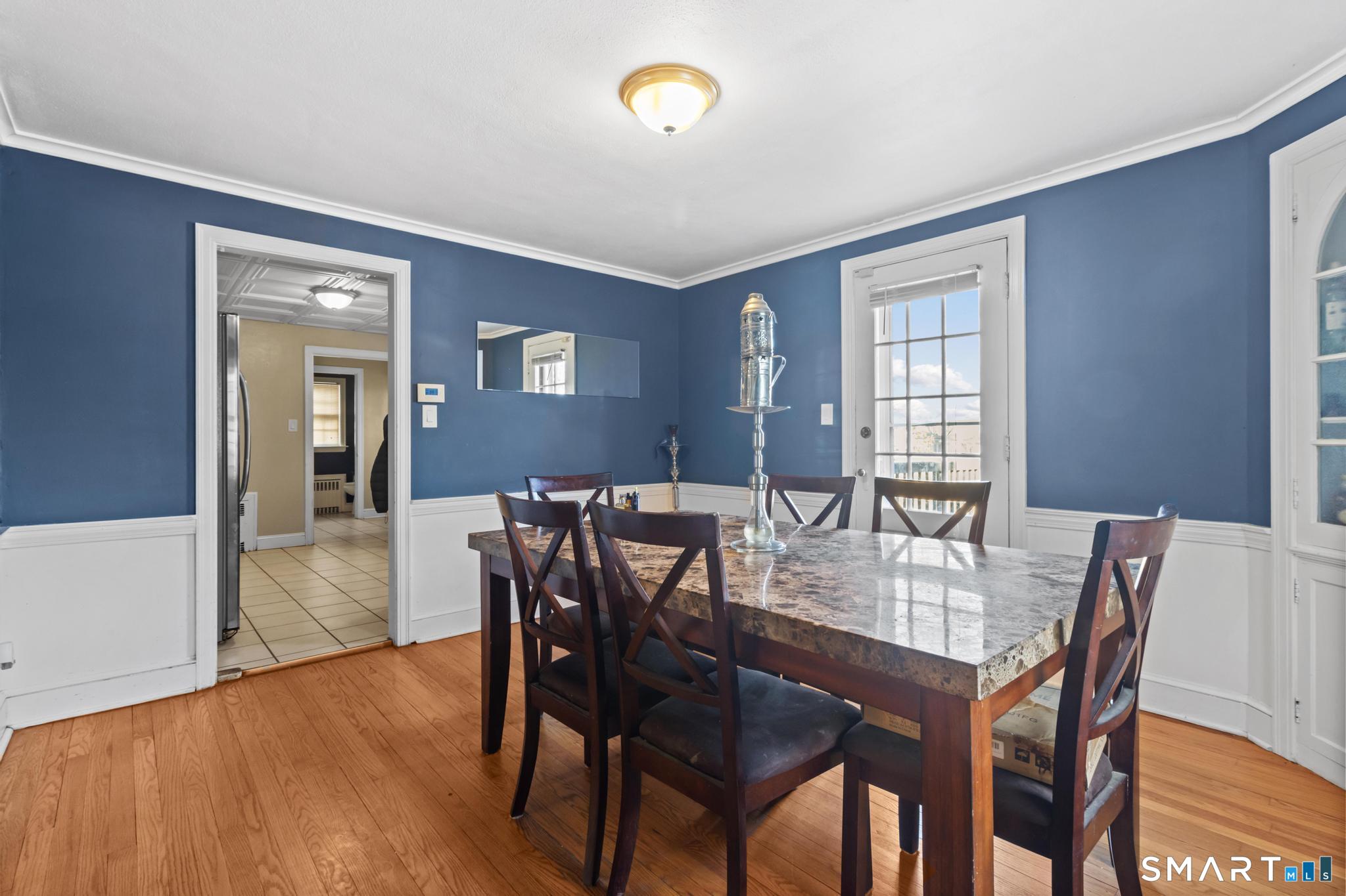 168 Hubbard Road Hartford, CT 06114 - Photo 8 of 27 a view of a dining room with furniture and wooden floor