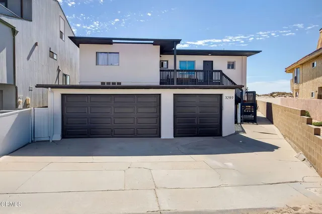 a view of a livingroom with wooden floor and window