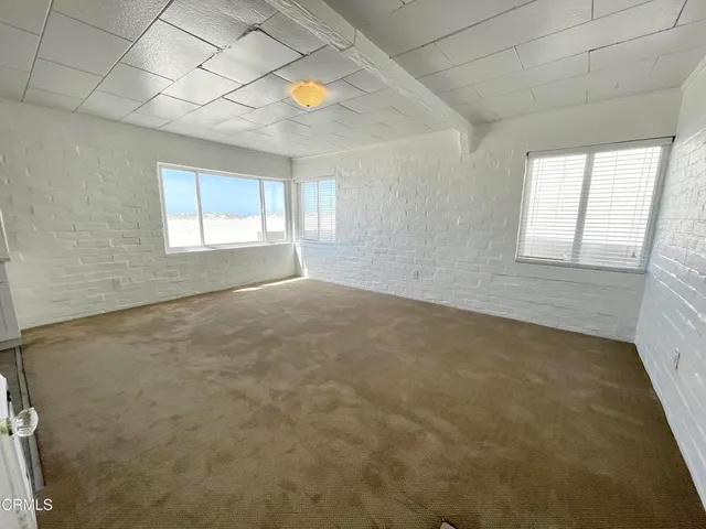 a kitchen with a refrigerator sink and stove