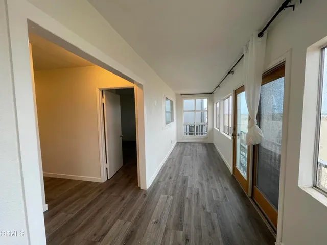 a kitchen with a refrigerator and a stove top oven