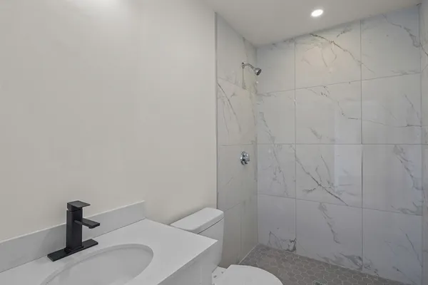 a bathroom with a sink and toilet