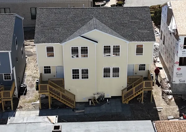 a aerial view of a house with a yard